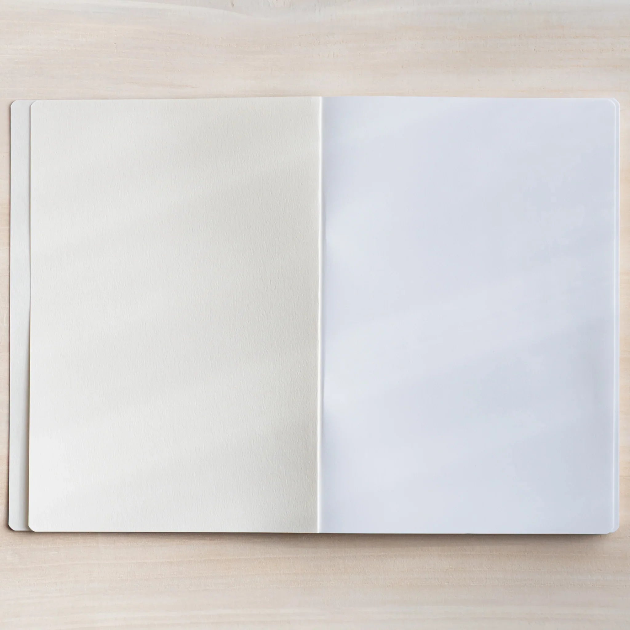 CANOPUS notebook spine detail showing white stitching and binding construction showing product quality and design details