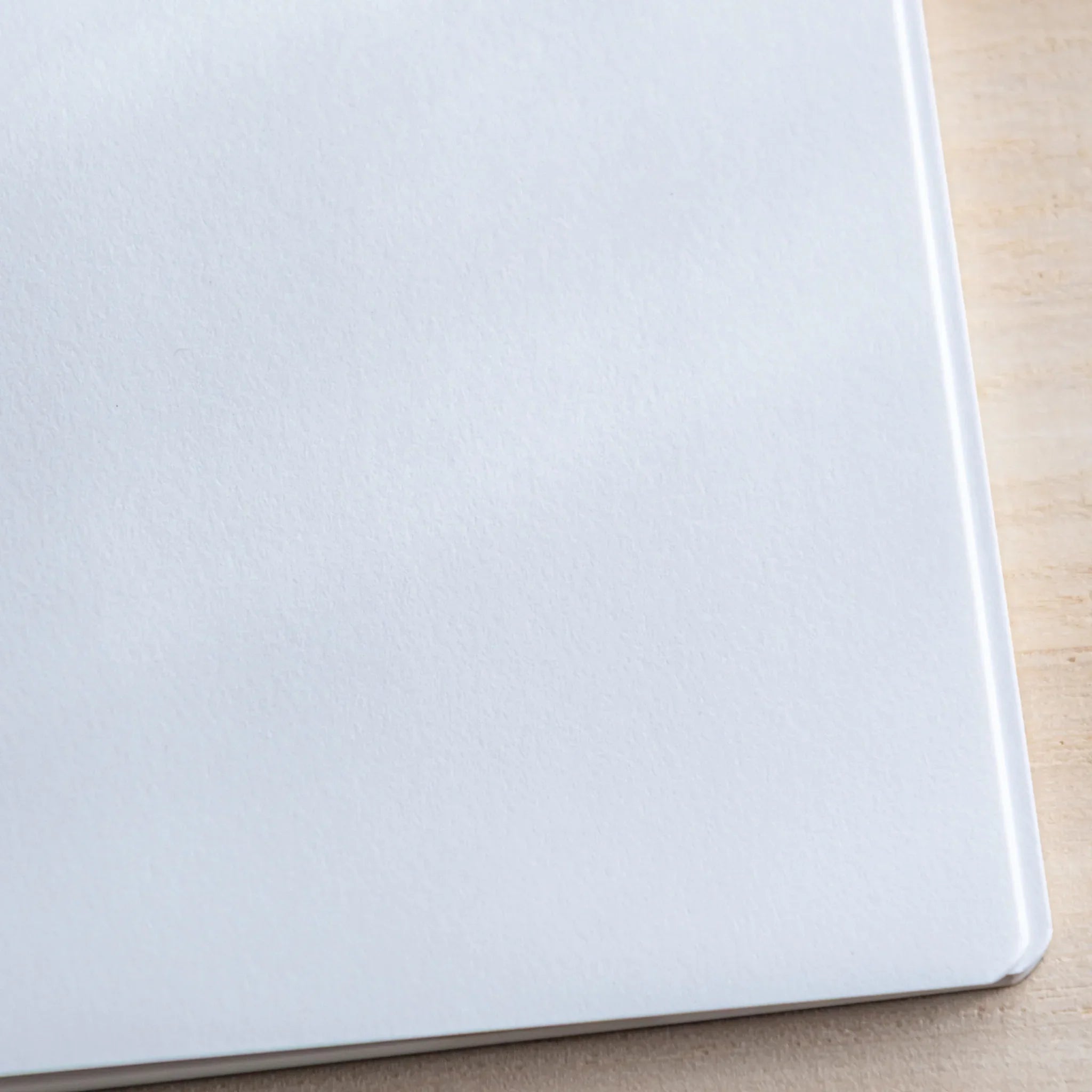 CANOPUS notebook opened at angle revealing back cover and page thickness showing product quality and design details