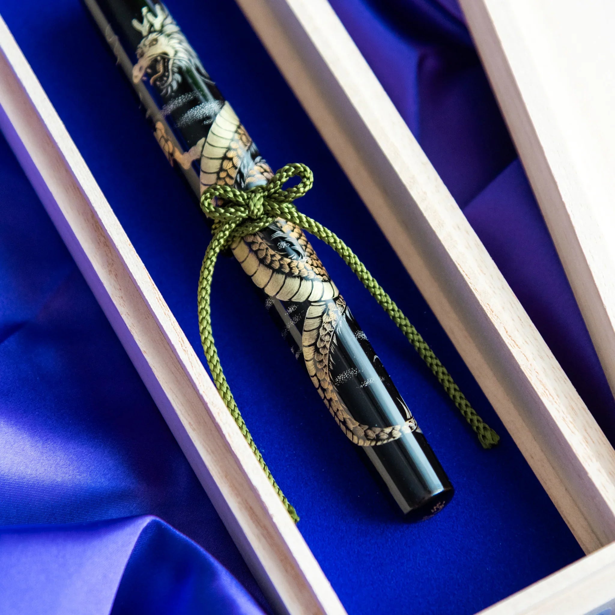 Chinkin Dragon fountain pen close-up showing gold dragon chinkin decoration on black lacquer showing product quality and d