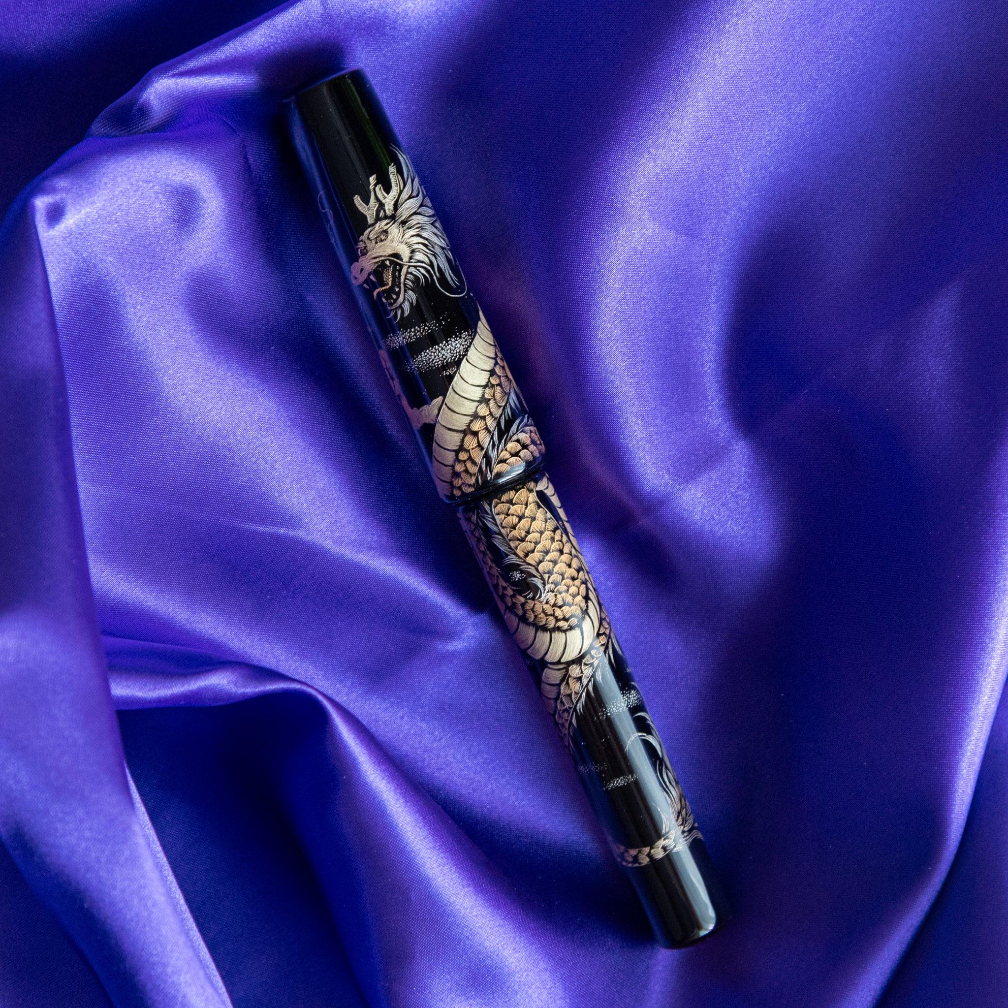 Gold embossed dragon detail on Chinkin Dragon pen barrel showing chinkin craftsmanship showing product quality and design 