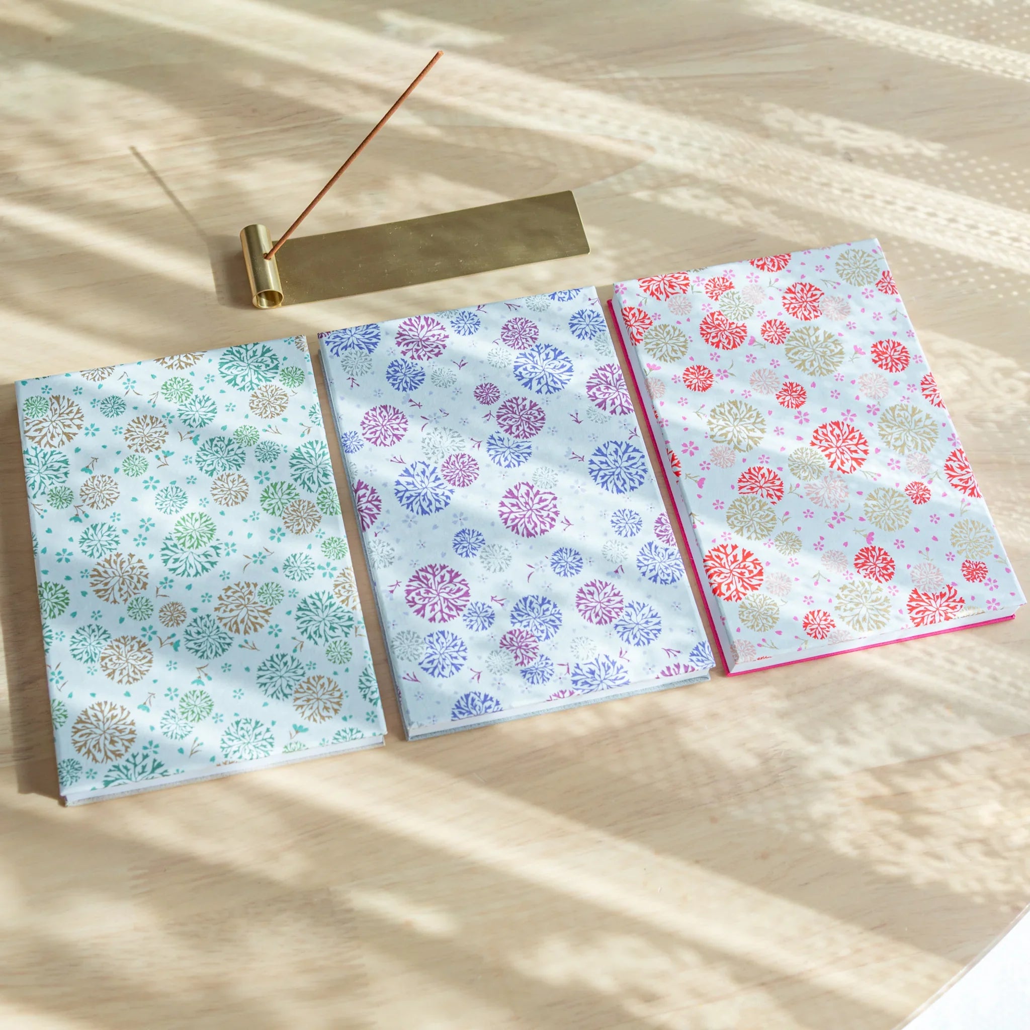 Gift set presentation of Chrysanthemum Harmony purple washi goshuincho with pen and package with decorative chrysanthemum 