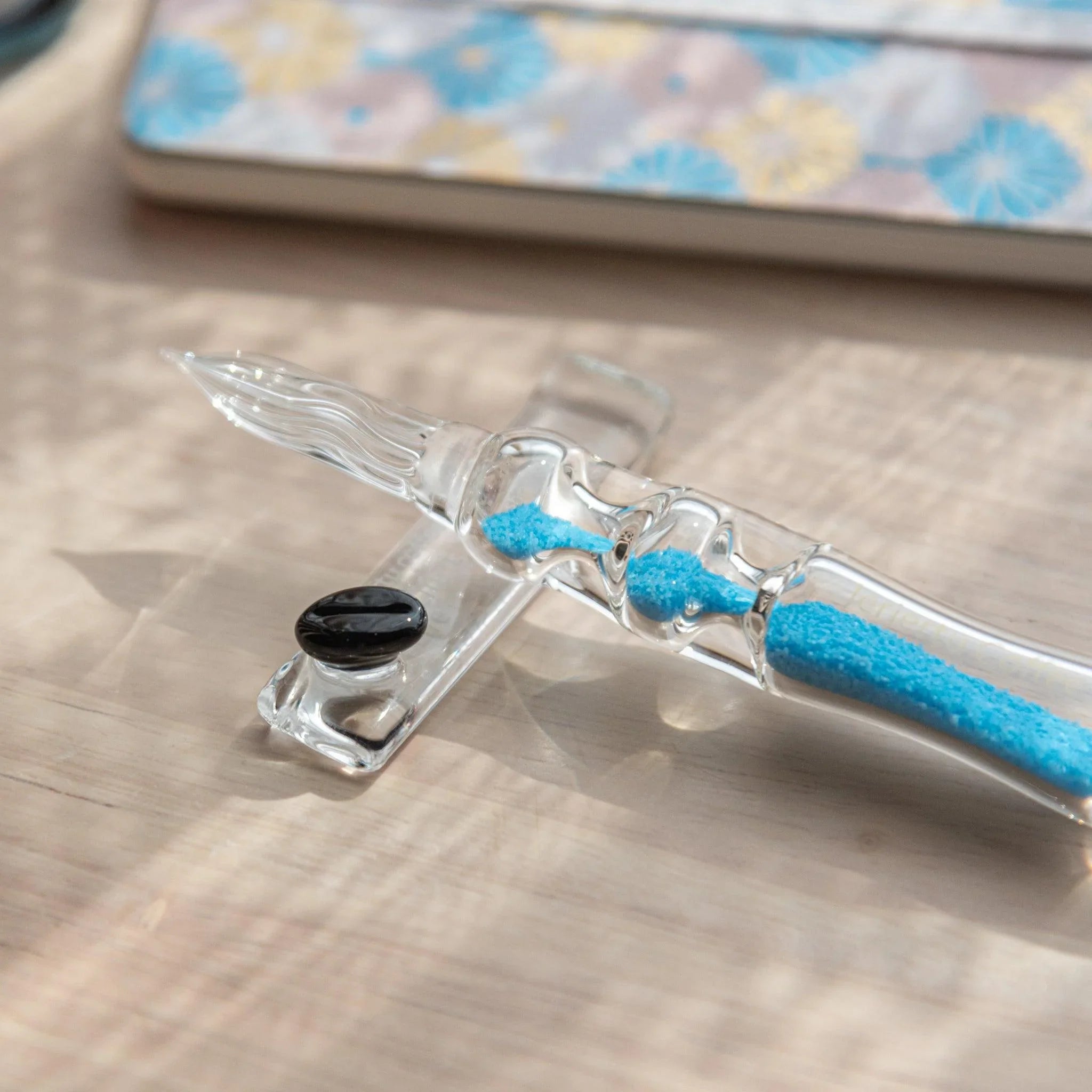 Cote d'Azur Hourglass Glass Dip Pen side profile showing symmetrical hourglass glass reservoir with blue-tinted chambers
