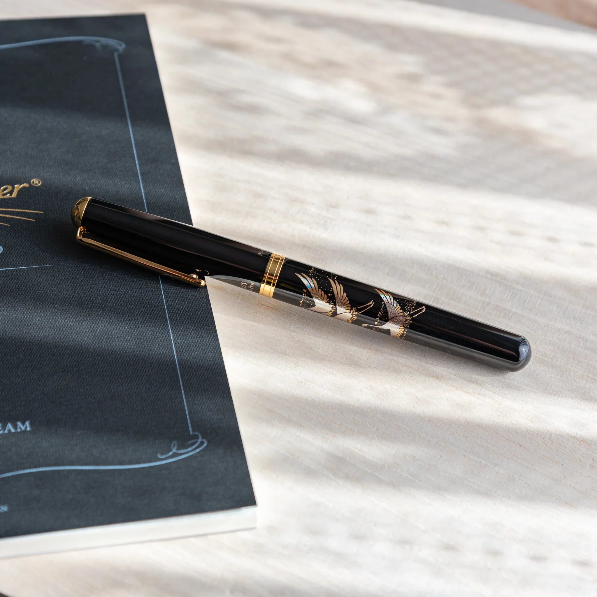Crane Yamanaka fountain pen with lacquer design shown in composition shown in detail product composition view