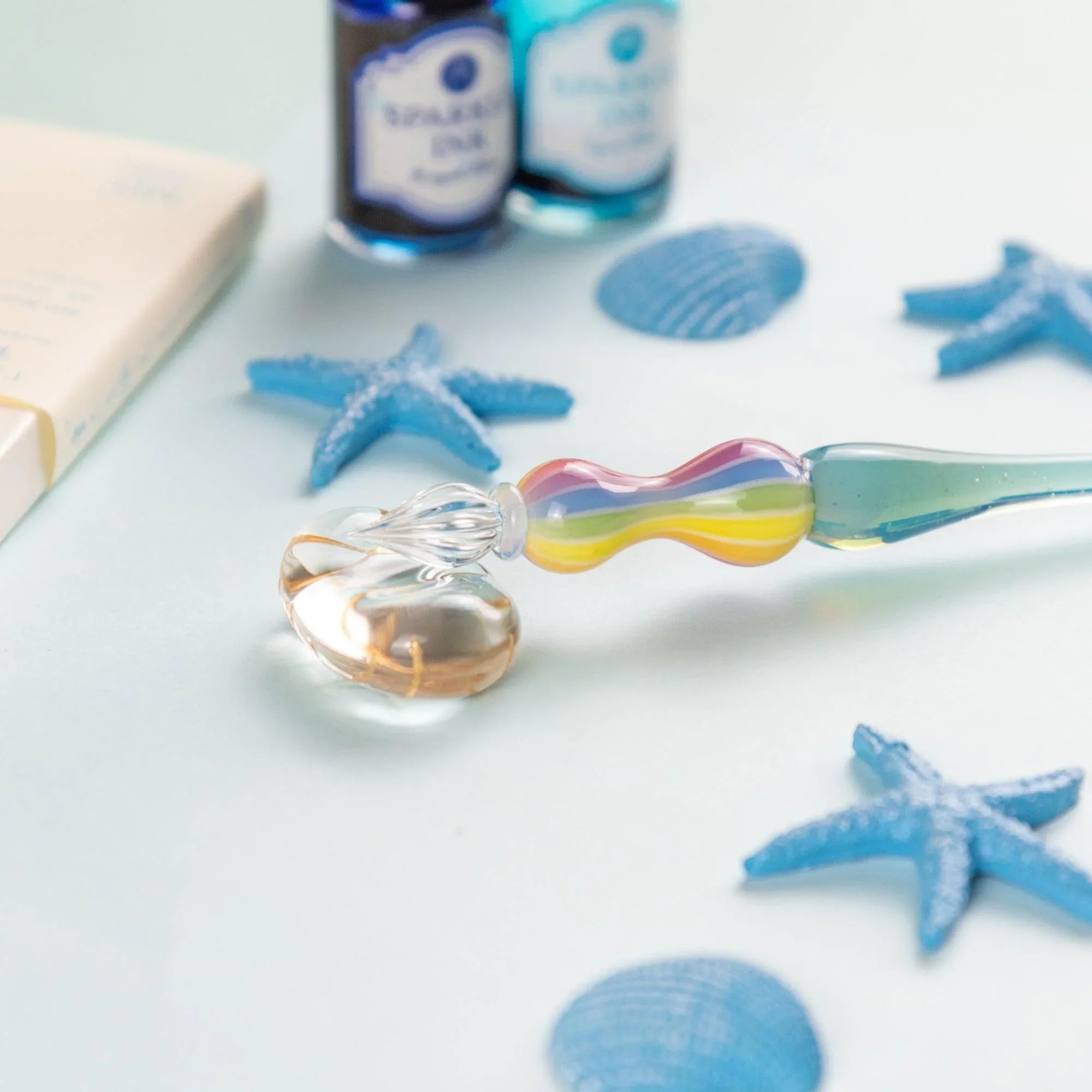 Close-up of Marin glass pen showing translucent colors and smooth glass surface quality and detail showing product quality