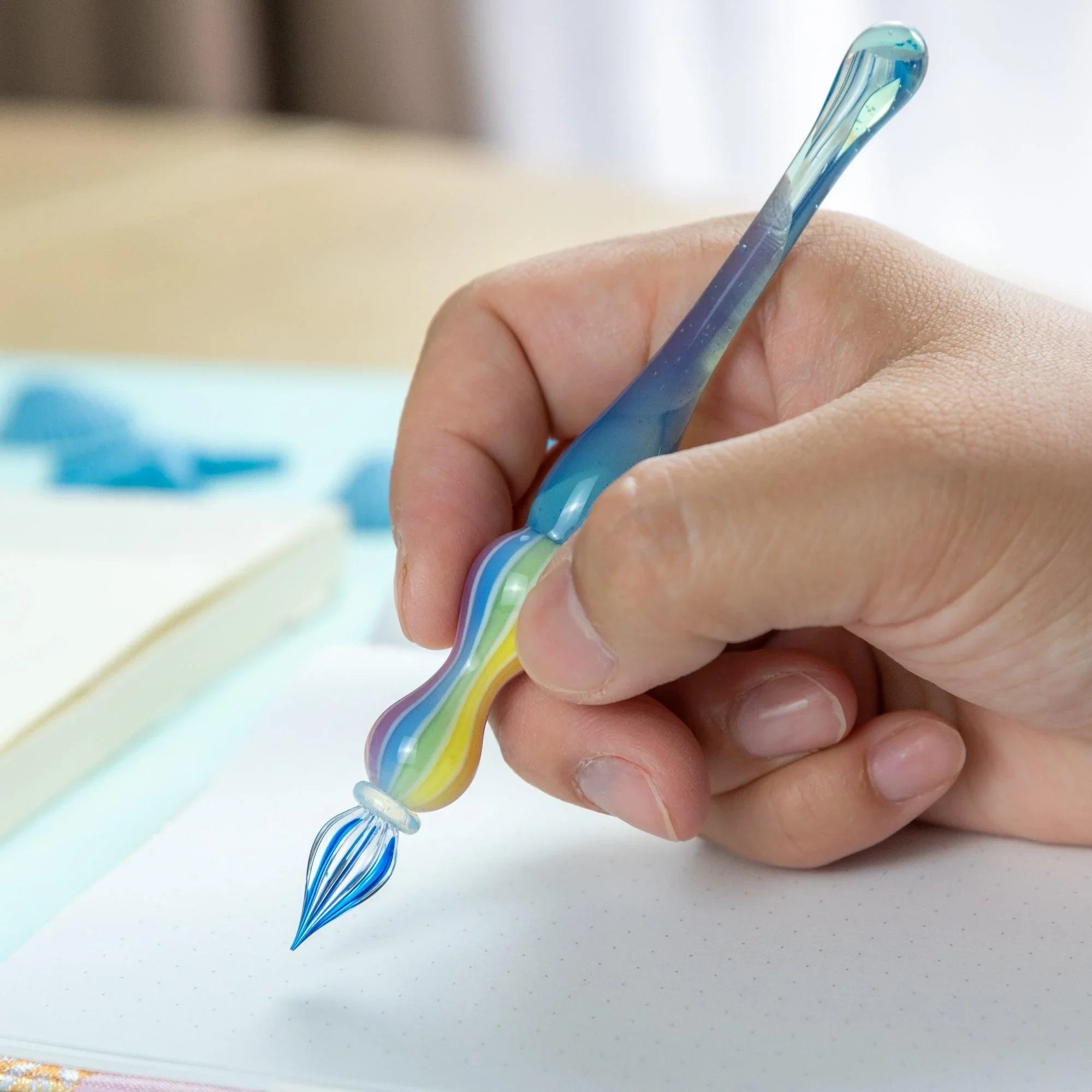 Marin glass dip pen with coordinating ink bottle showing ink capacity and calligraphy use demonstration
