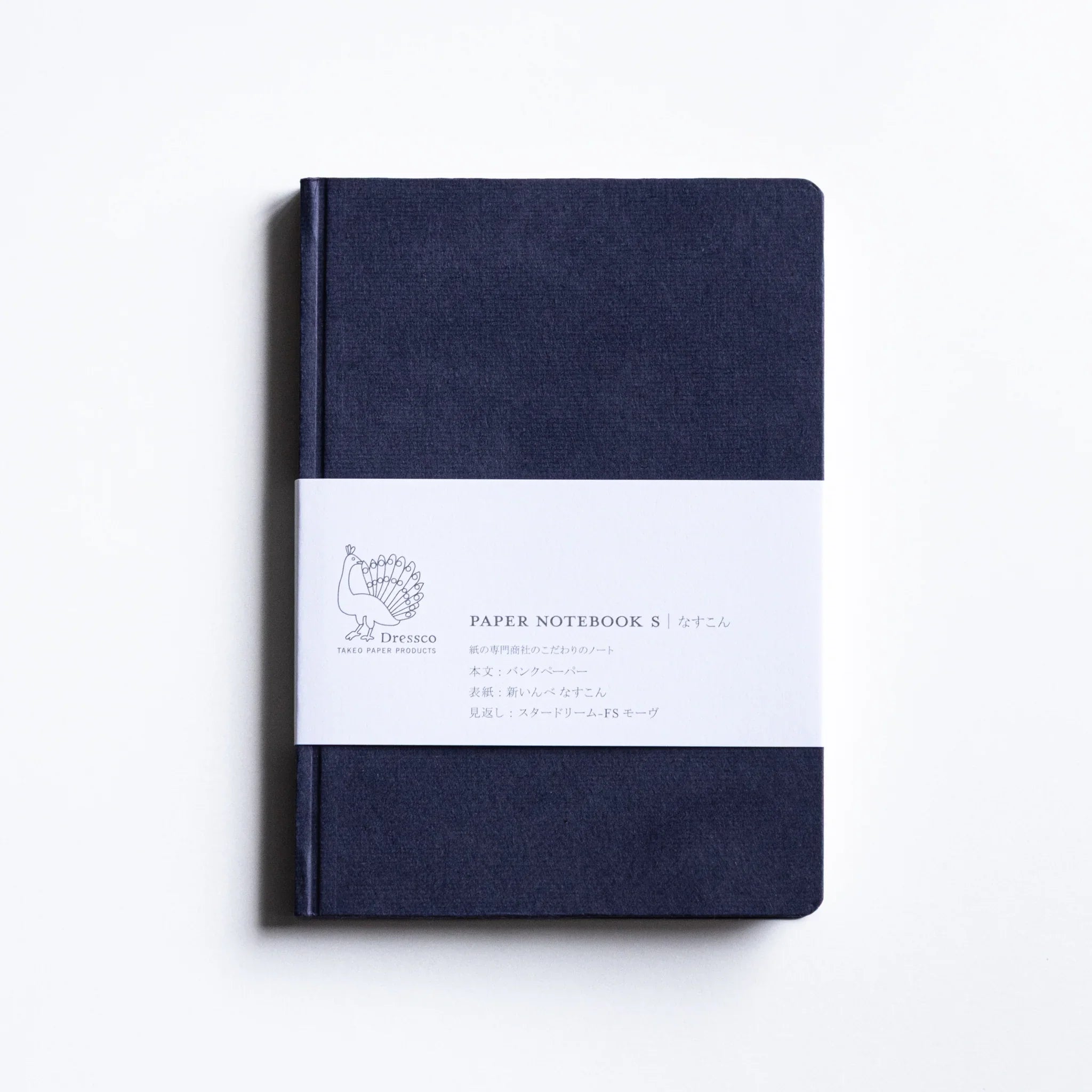 Dressco Bank Ledger Paper A6 notebook back cover showing plain cover surface and stitched spine binding detail
