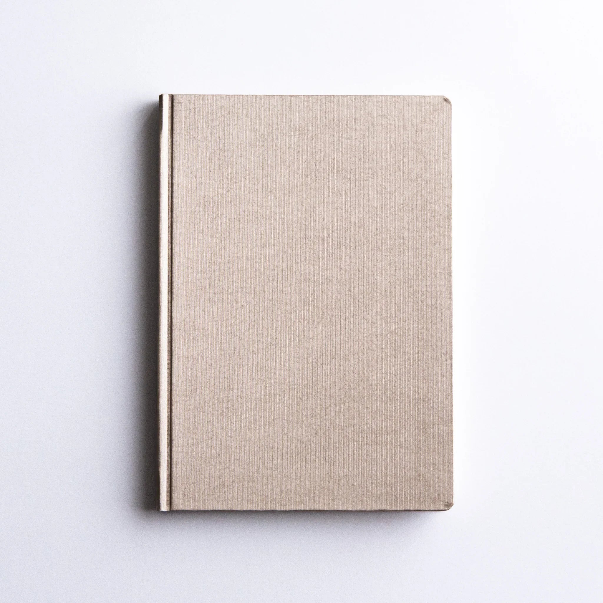 Dressco Bank Ledger Paper A6 notebook open spread showing the bank ledger ruling format and Japanese paper surface