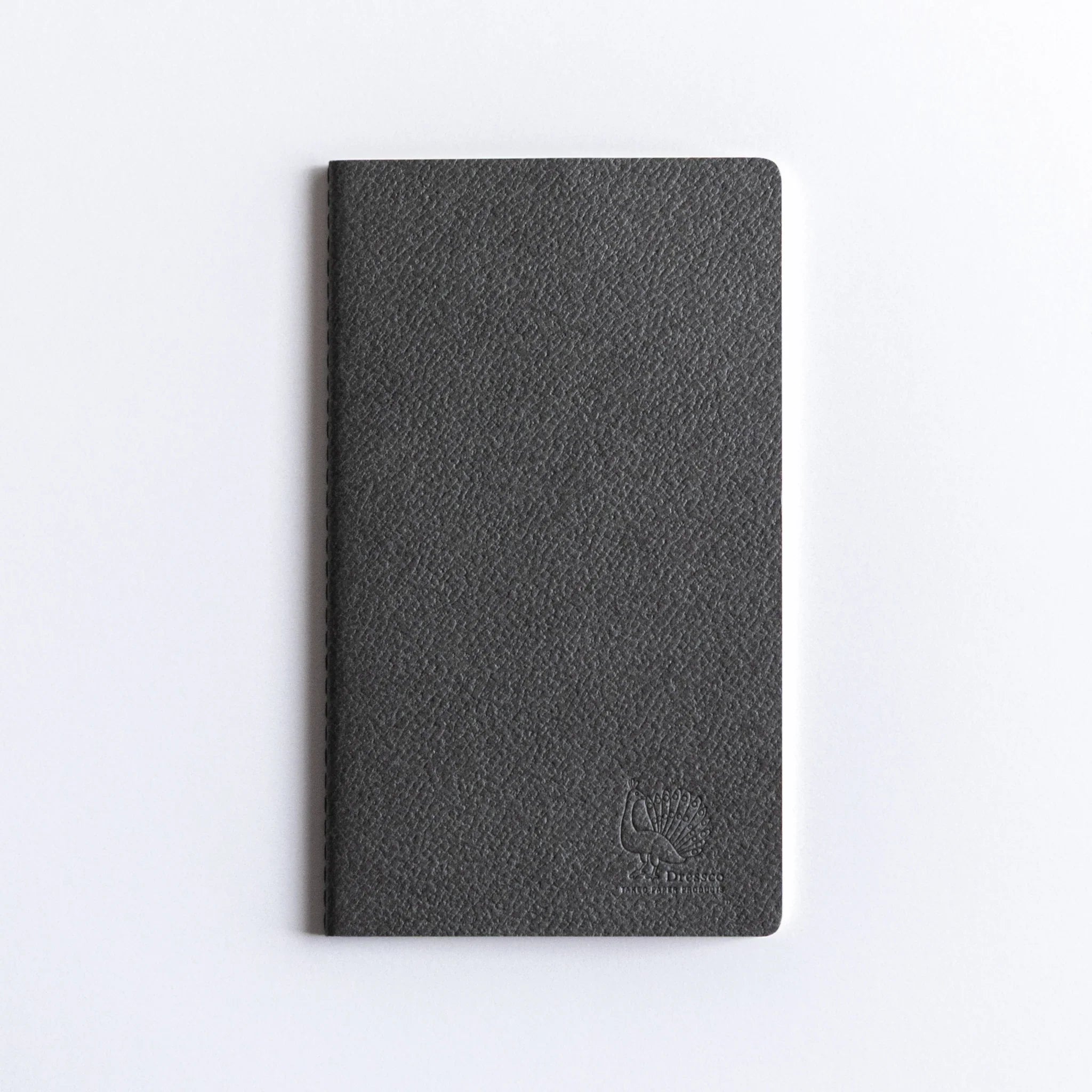Product wrapper on Dressco A6 notebook showing Japanese text and detailed specifications and manufacturing information