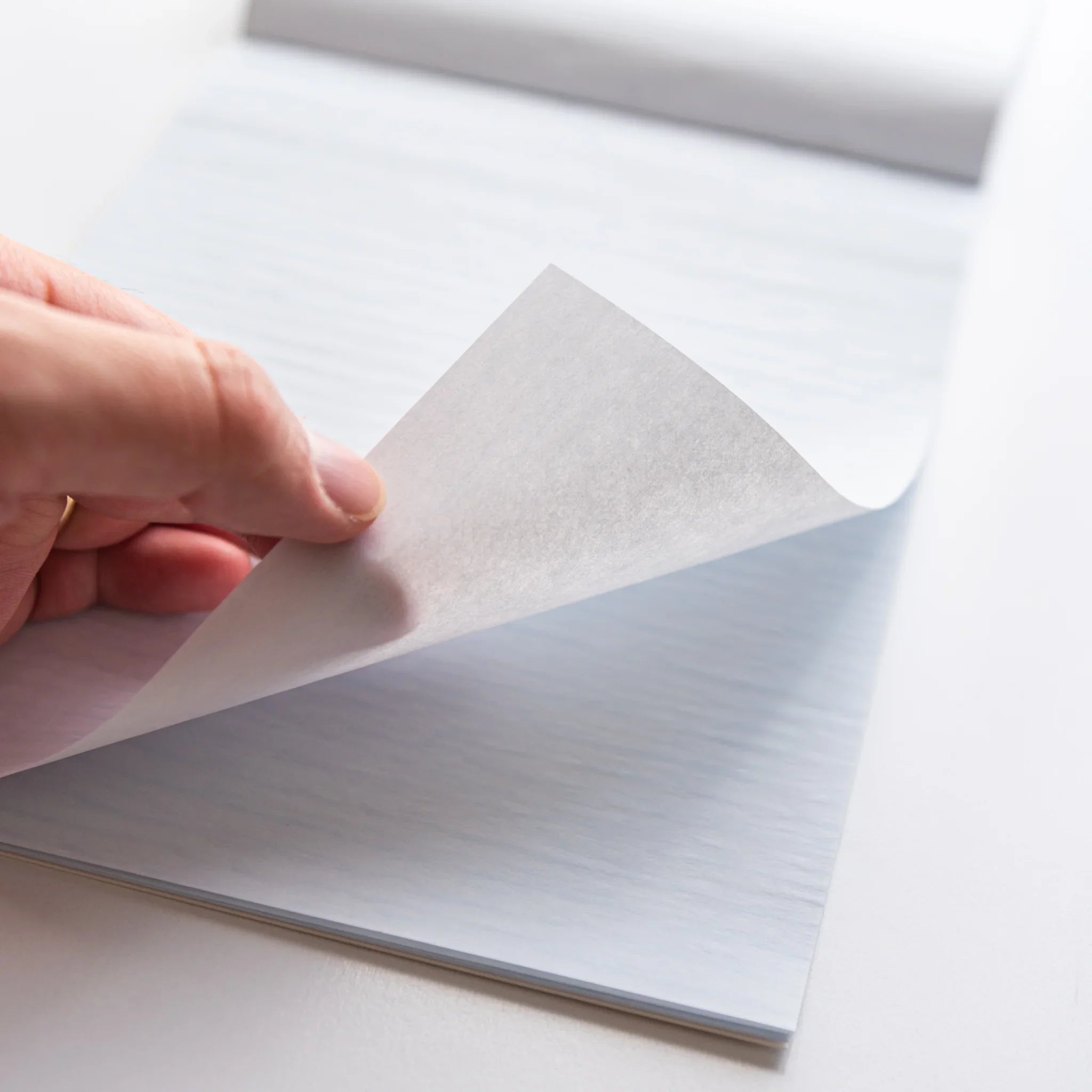 Interior pages of writing pad showing writing surface quality and transparency showing product quality and design details