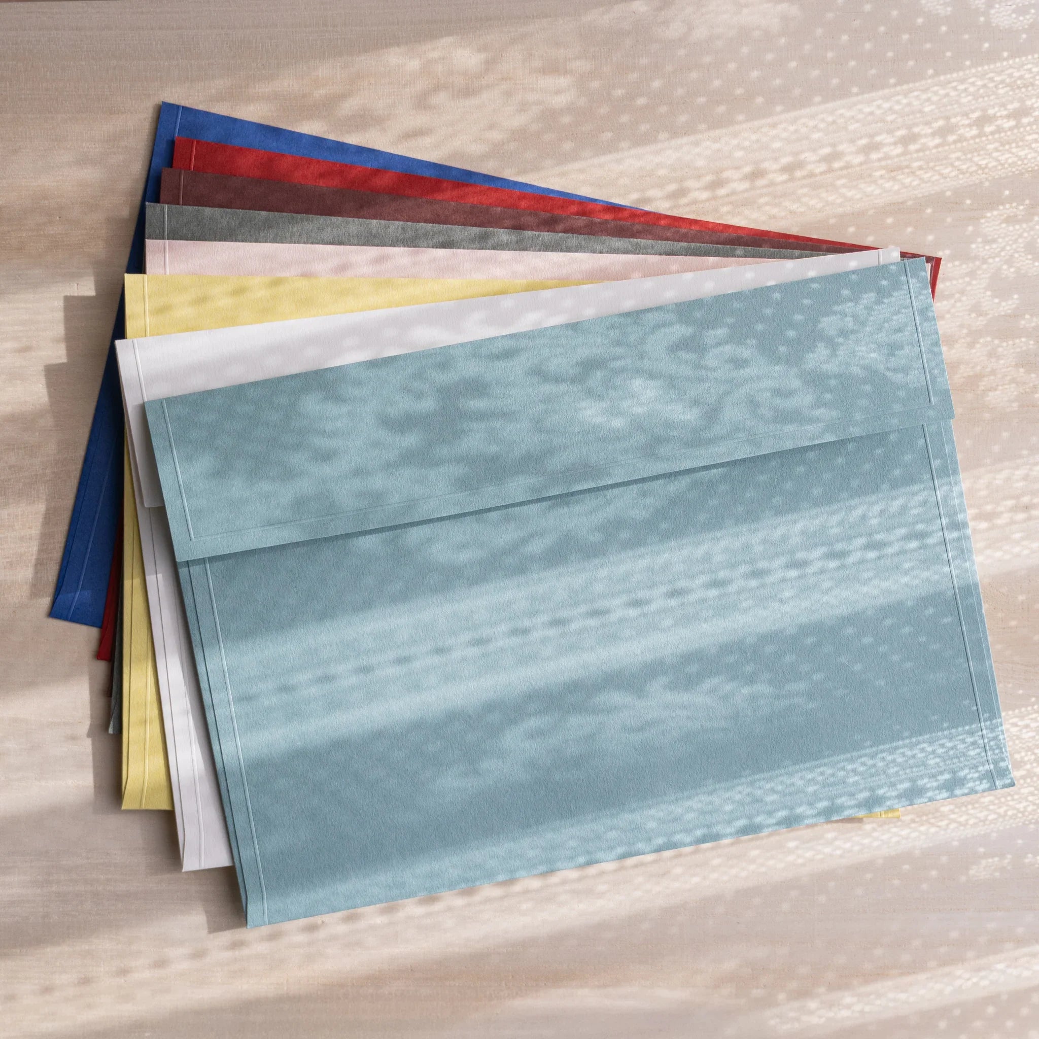 Dressco ivory large embossed envelope image one, front view showing sealed flap, with raised embossing, set of three