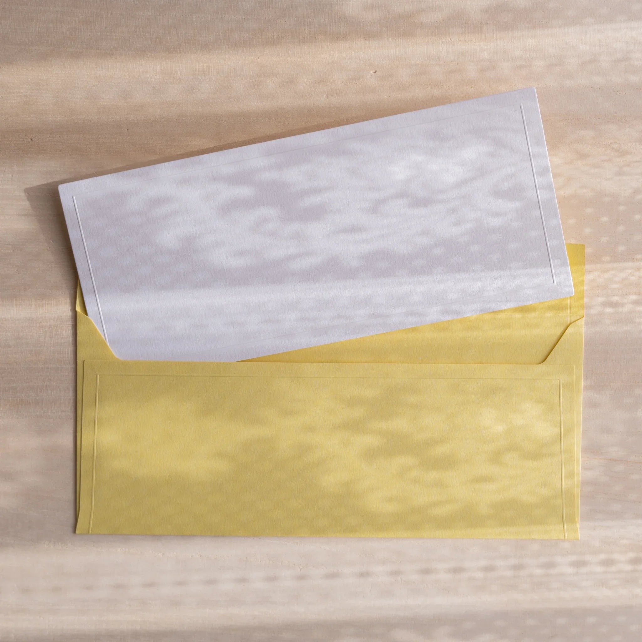Dressco ivory medium embossed envelope image thirty, stacked arrangement view, with embossing elegance, set of three