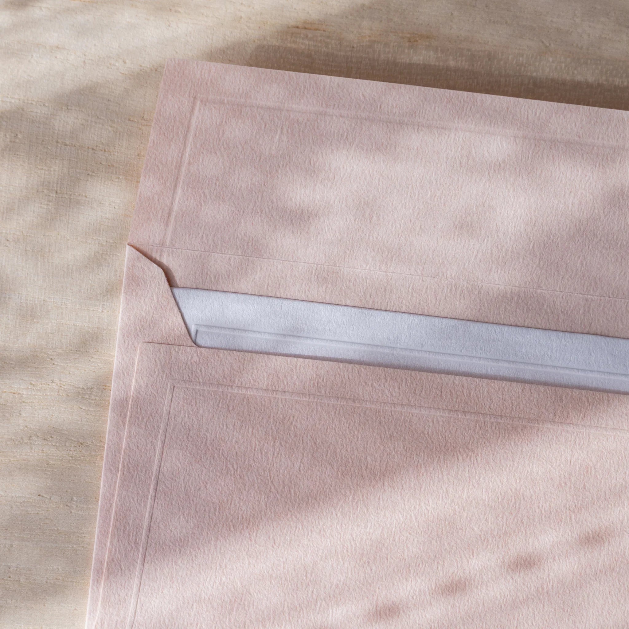 Dressco embossed envelope collection, sage green shade, arranged display showing texture                      