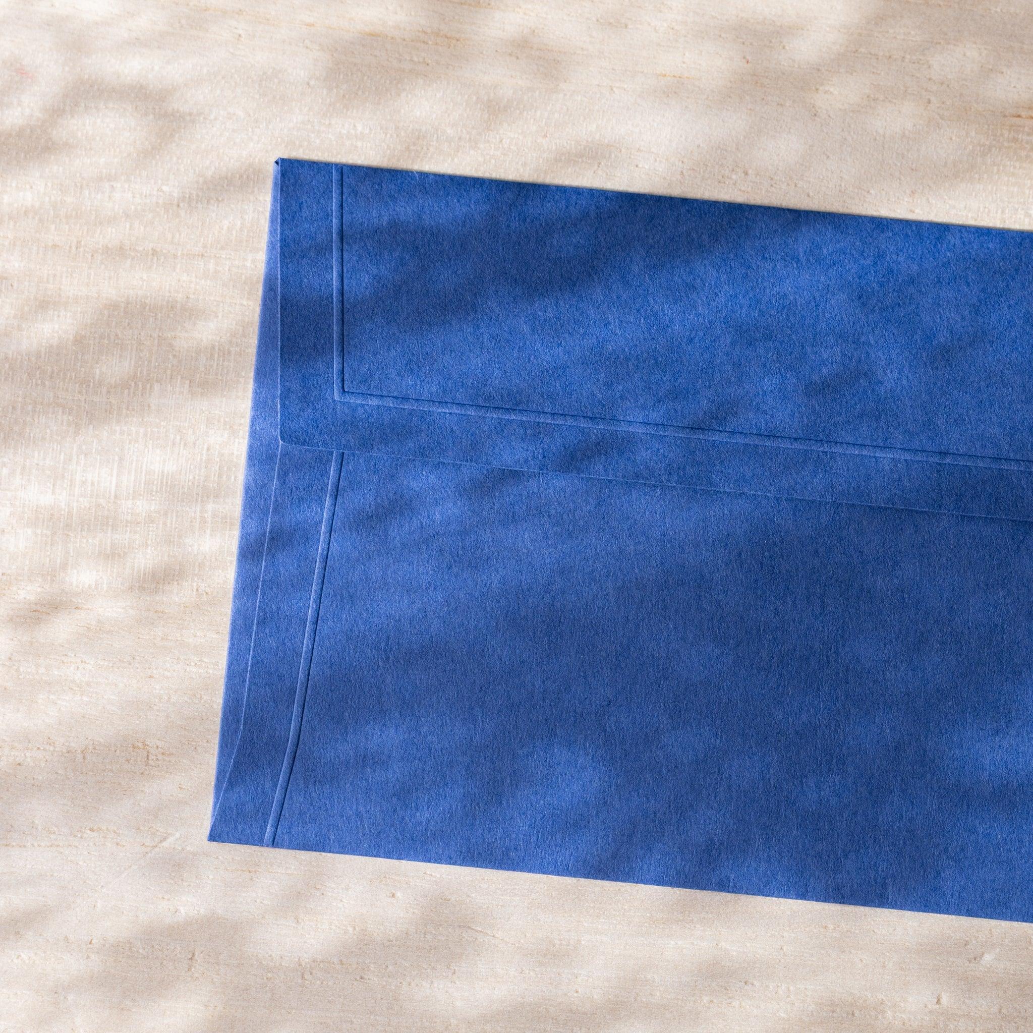 Dressco envelope featuring sage green, flat lay showing embossed surface design                               