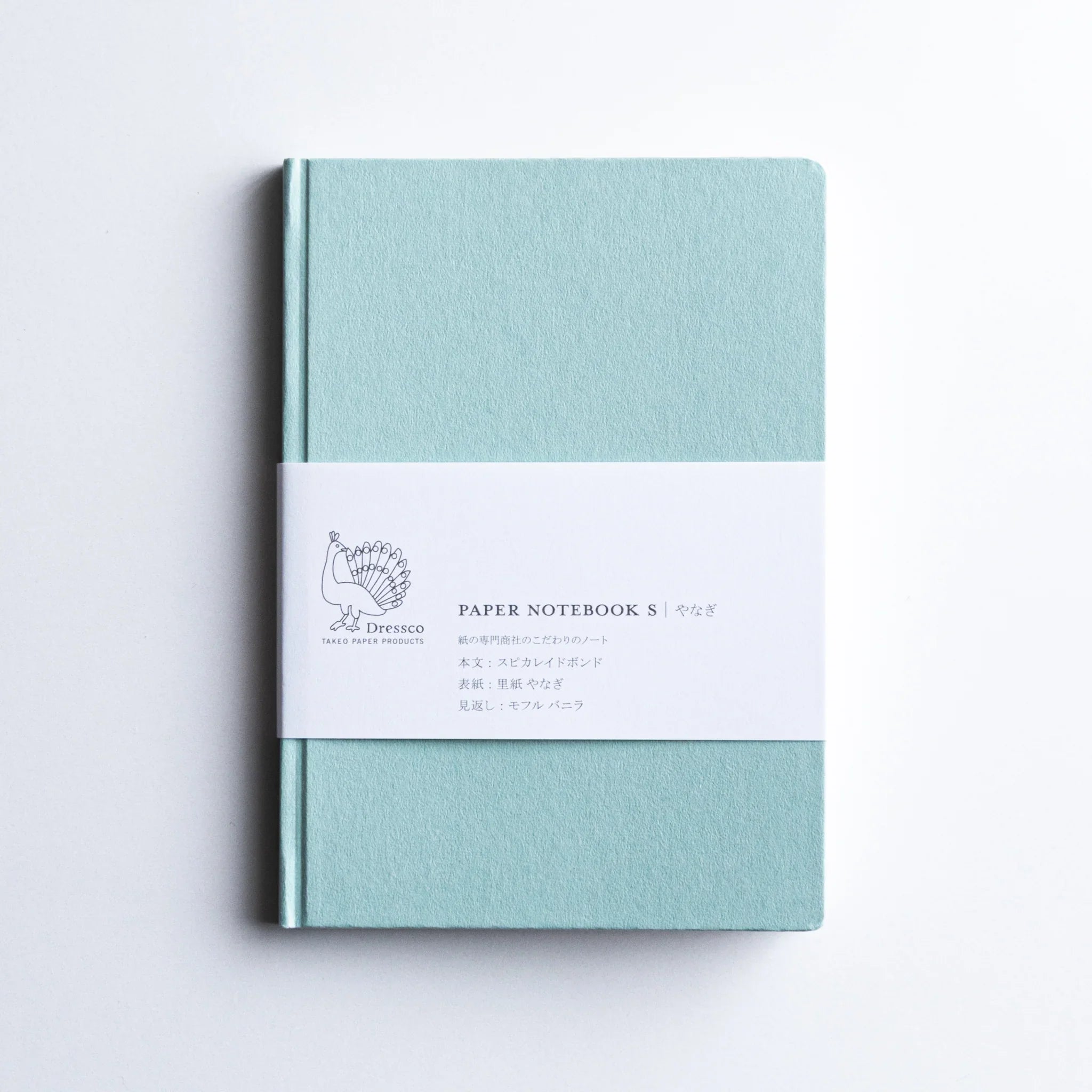 Dressco Spica Laid Bond Paper A6 notebook open spread showing the ruled interior pages and laid bond paper surface