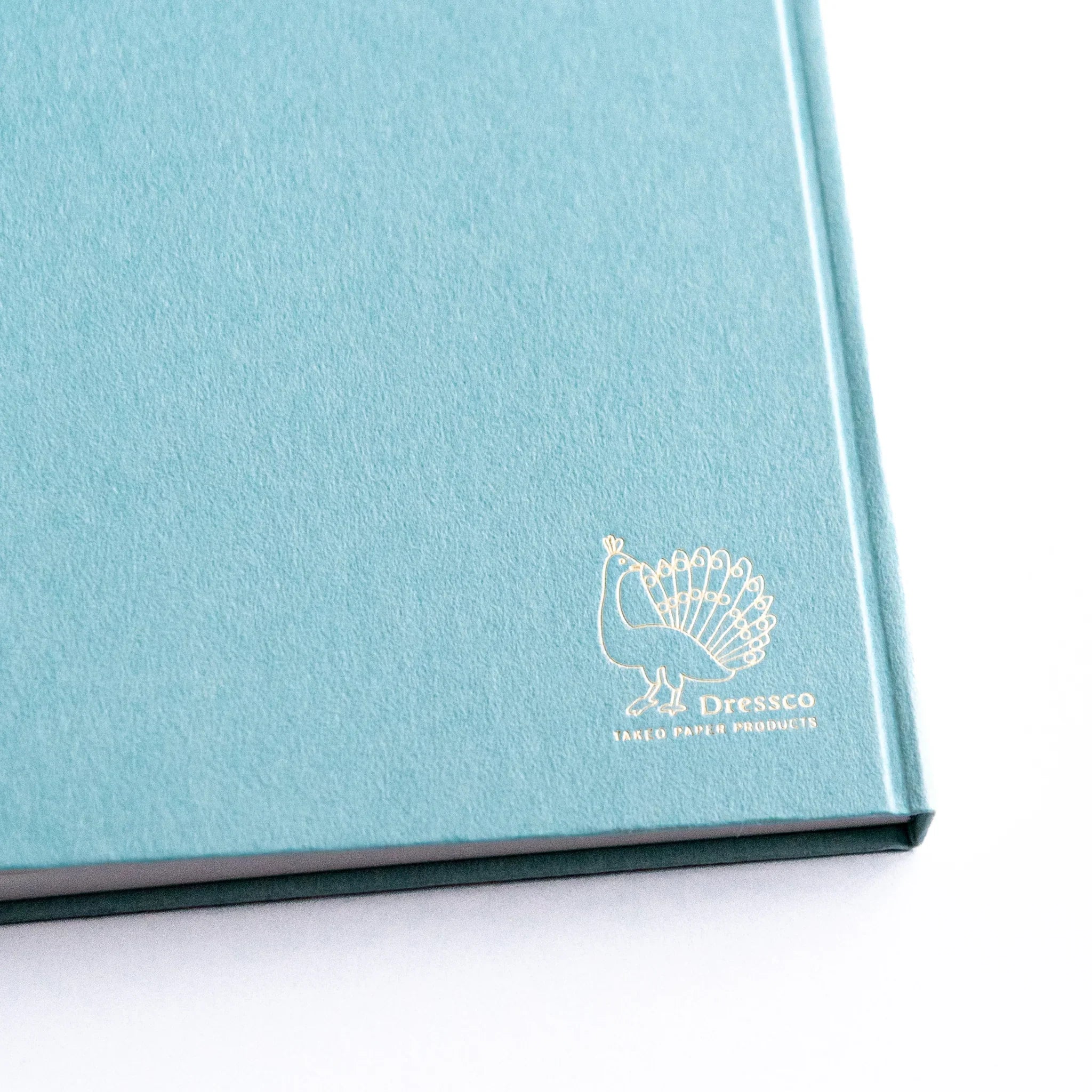 Surface texture detail of Dressco Spica Laid Bond Paper A6 notebook showing the laid paper ribbed pattern in close-up