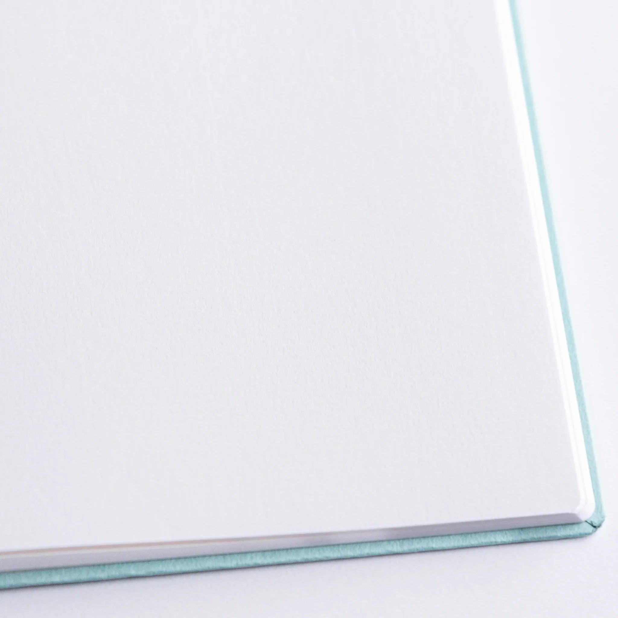 Textured surface close-up of Dressco Spica Laid Bond Paper B6 notebook showing the distinctive laid paper pattern