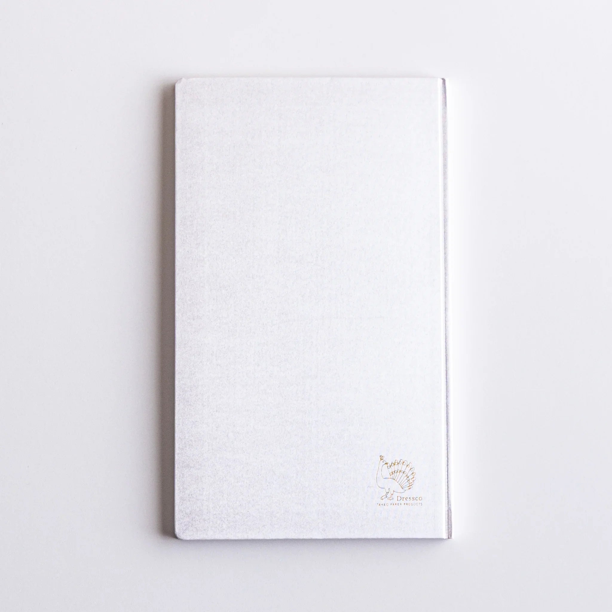 Top-down perspective of Dressco Spica Laid Bond Paper B6 notebook second variant with cover and binding visible