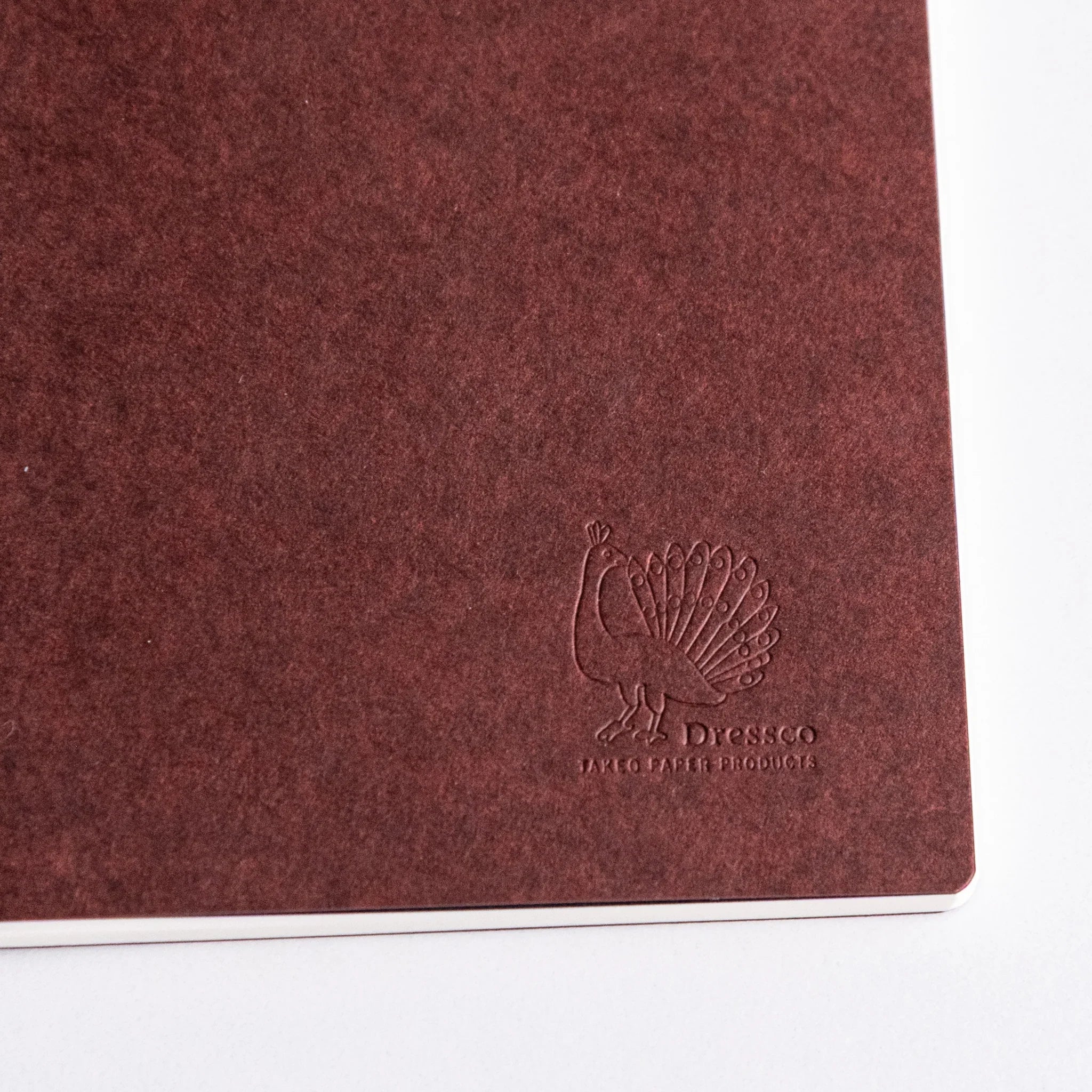 Close-up of Dressco notebook cover showing text logo and design placement for writing and personal correspondence use