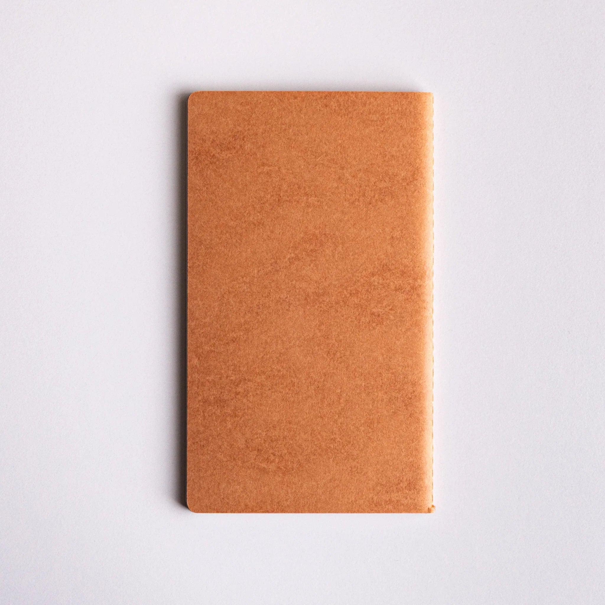 Dressco notebook displayed standing showing spine and binding stitching detail for writing and personal correspondence use