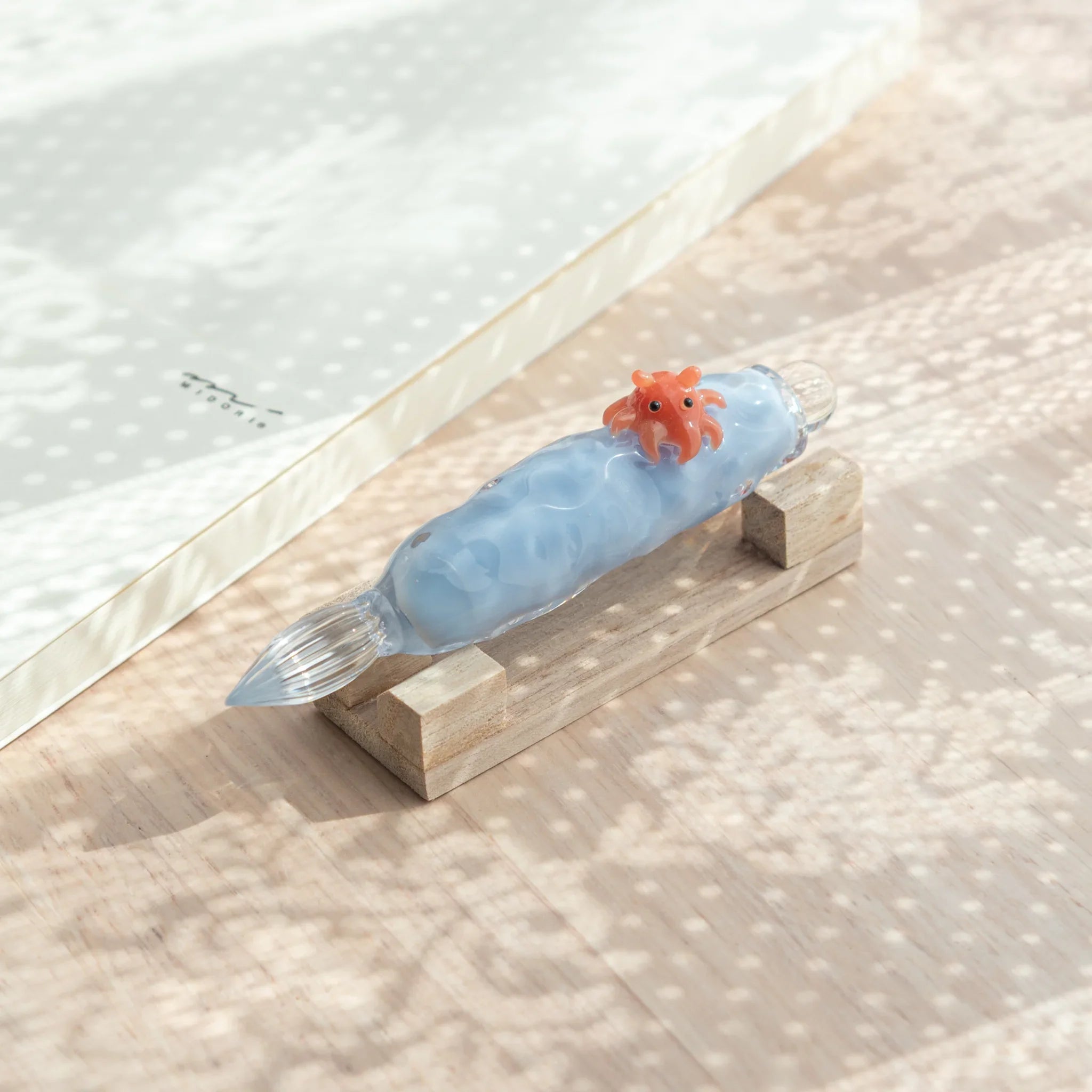 Dumbo dip pen with detailed resin work with adorable deep-sea creature perched on colored glass
