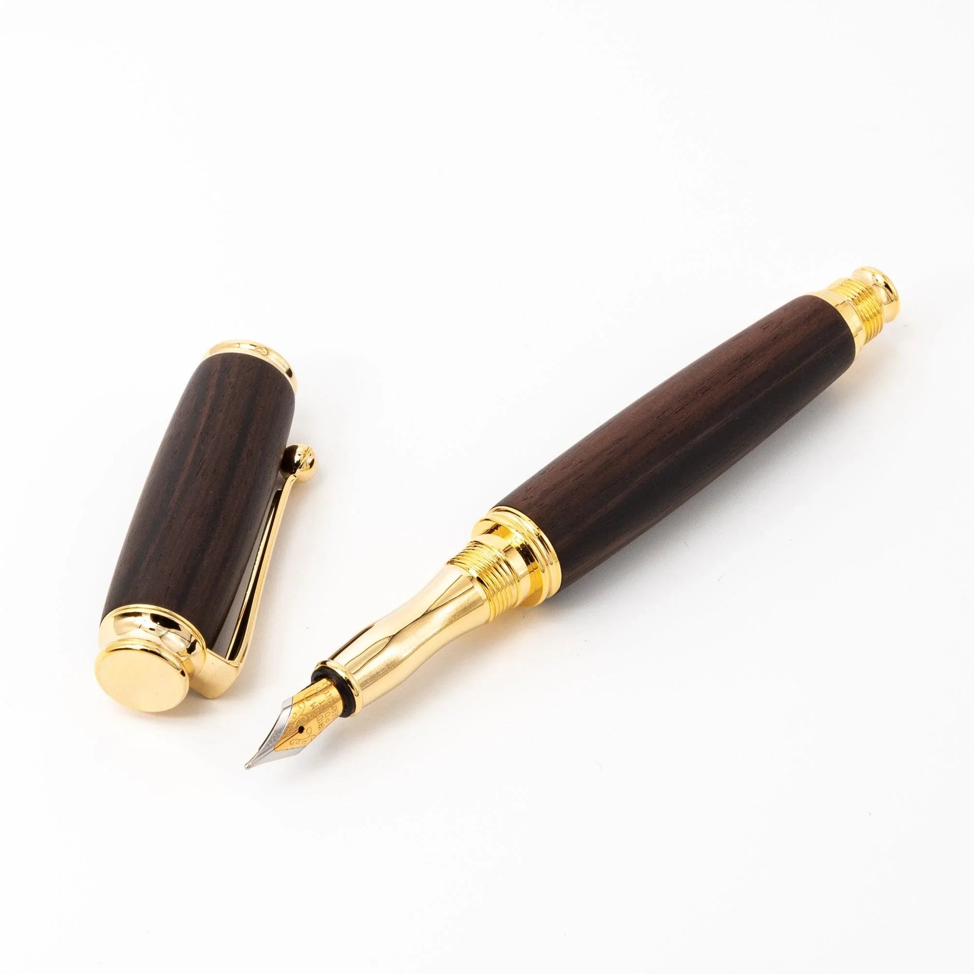 Ebony wood pen positioned on paper sheet demonstrating writing capability and use displayed clearly composition