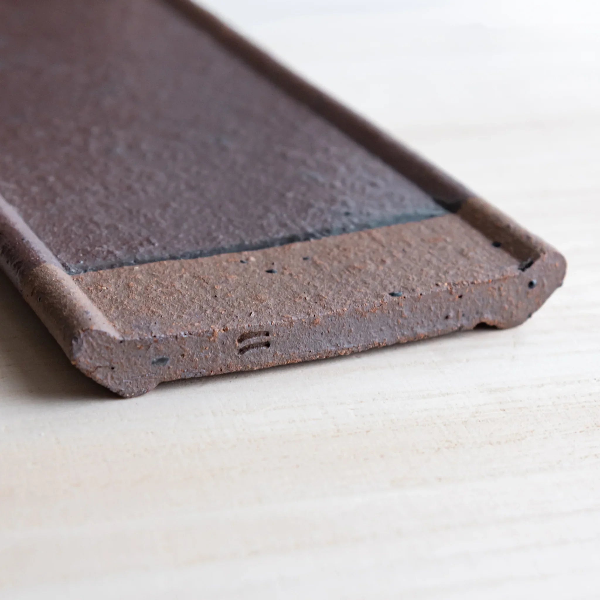 Echizen Kawara red tile ceramic pen tray with four slots shown in composition detail in detail view composition