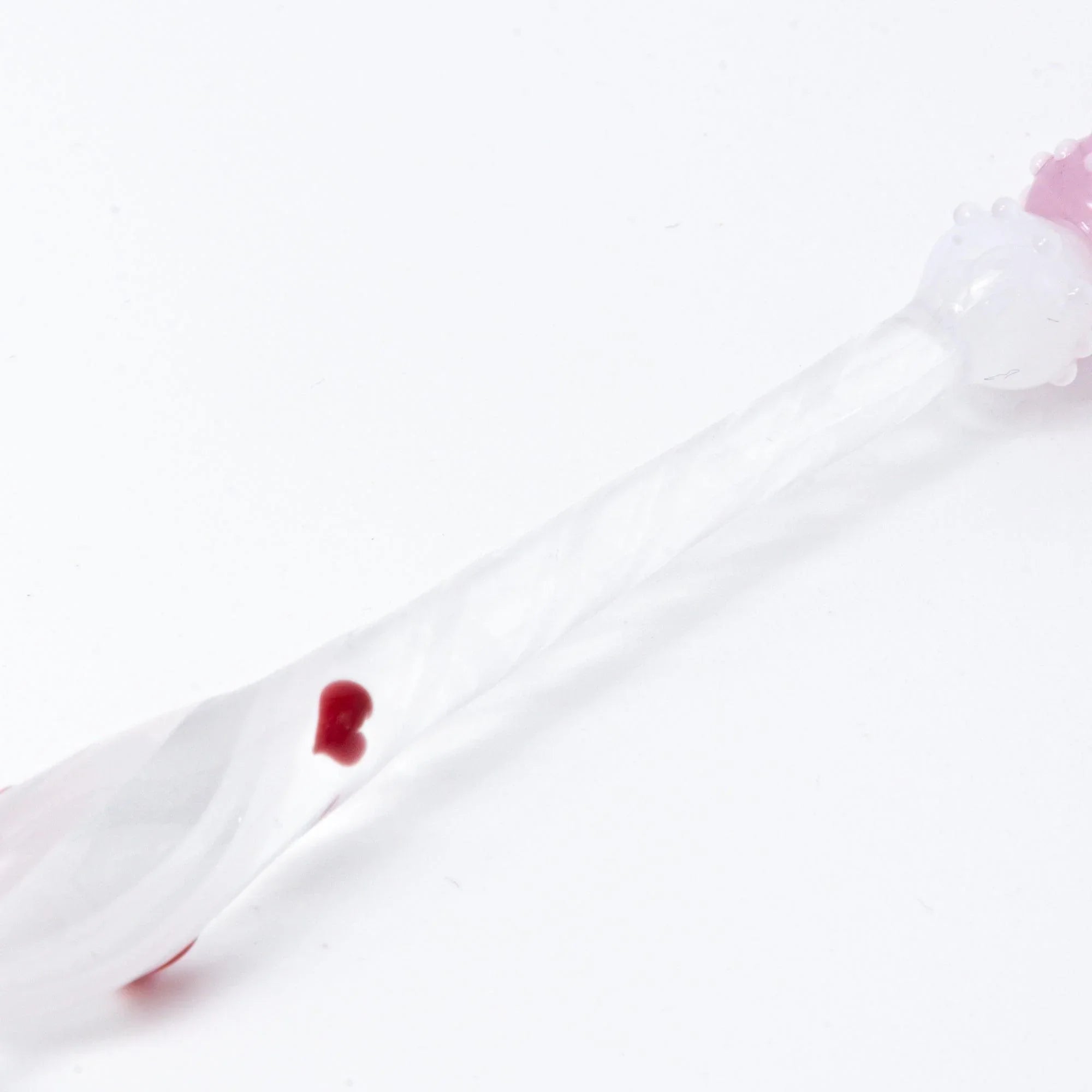 Lovery-Chan glass dip pen showing frosted pink translucent handle and decorative character detail element