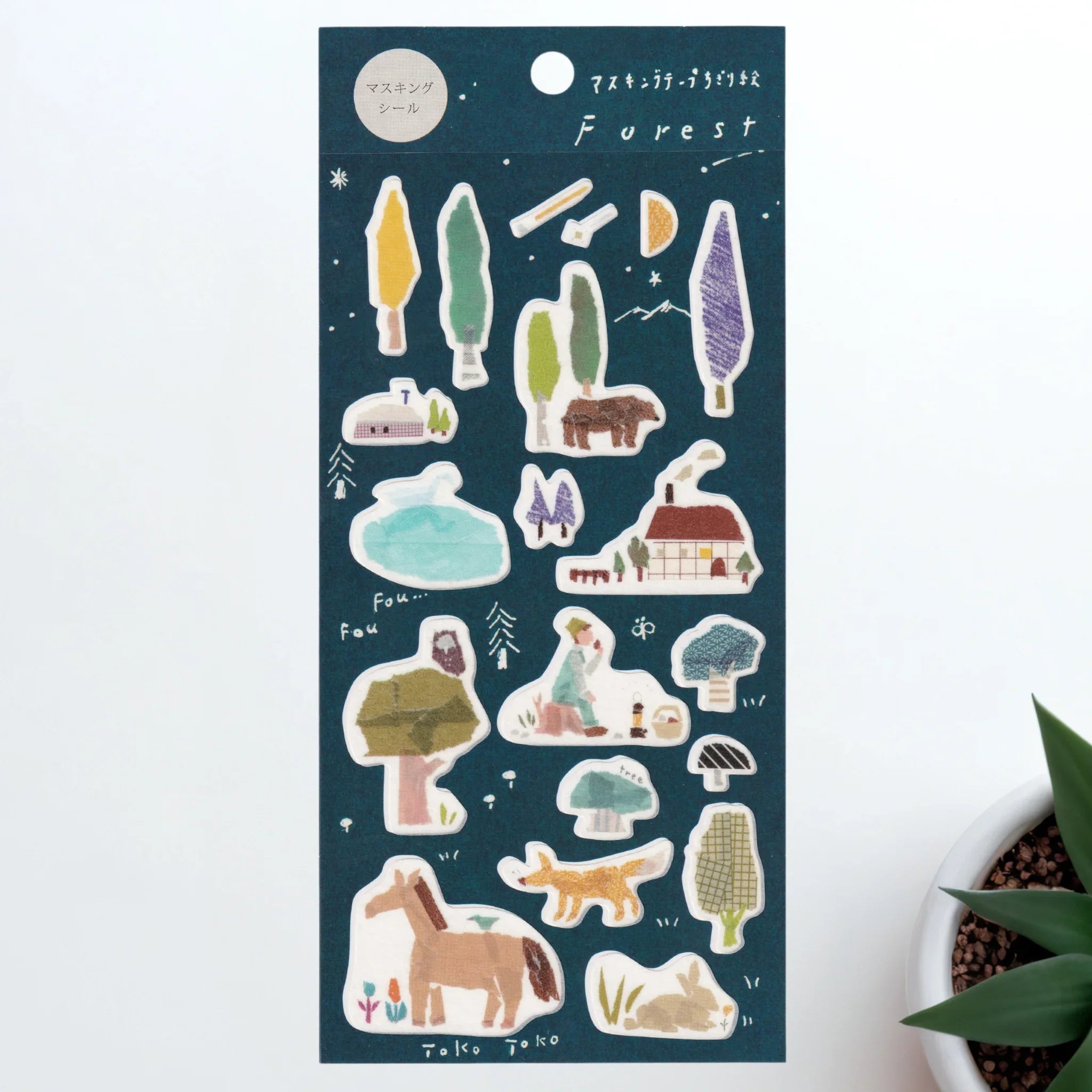 Dark teal Iyo washi sticker sheet with forest animals, trees, mushrooms and cottage house on night sky background