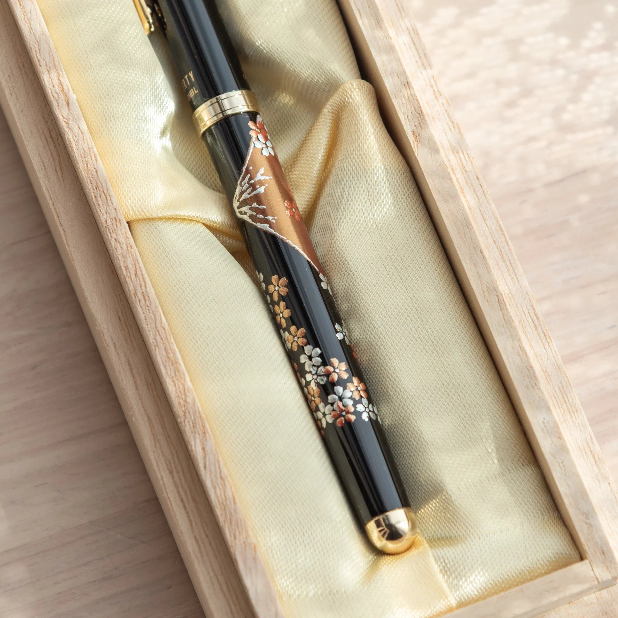 hand-made Yamanaka ballpoint pen features fuji sakura cherry blossom design in lacquer finish made