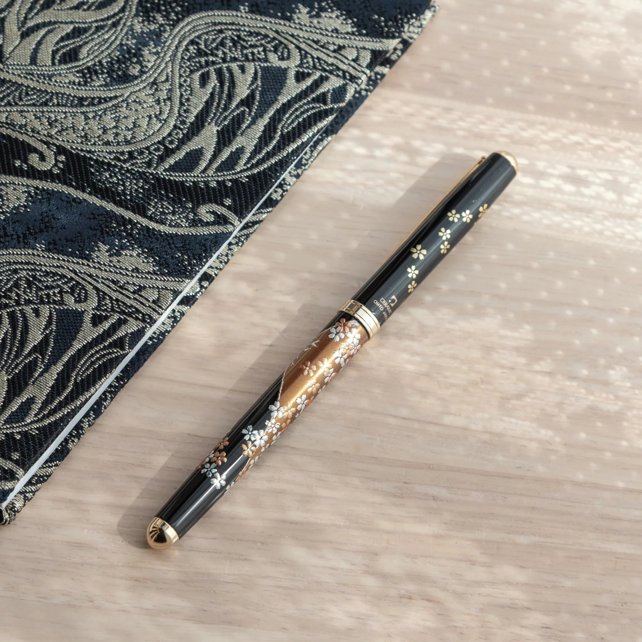 Japanese Yamanaka lacquer ballpoint pen features Mount Fuji and sakura cherry blossom seasonal artwork