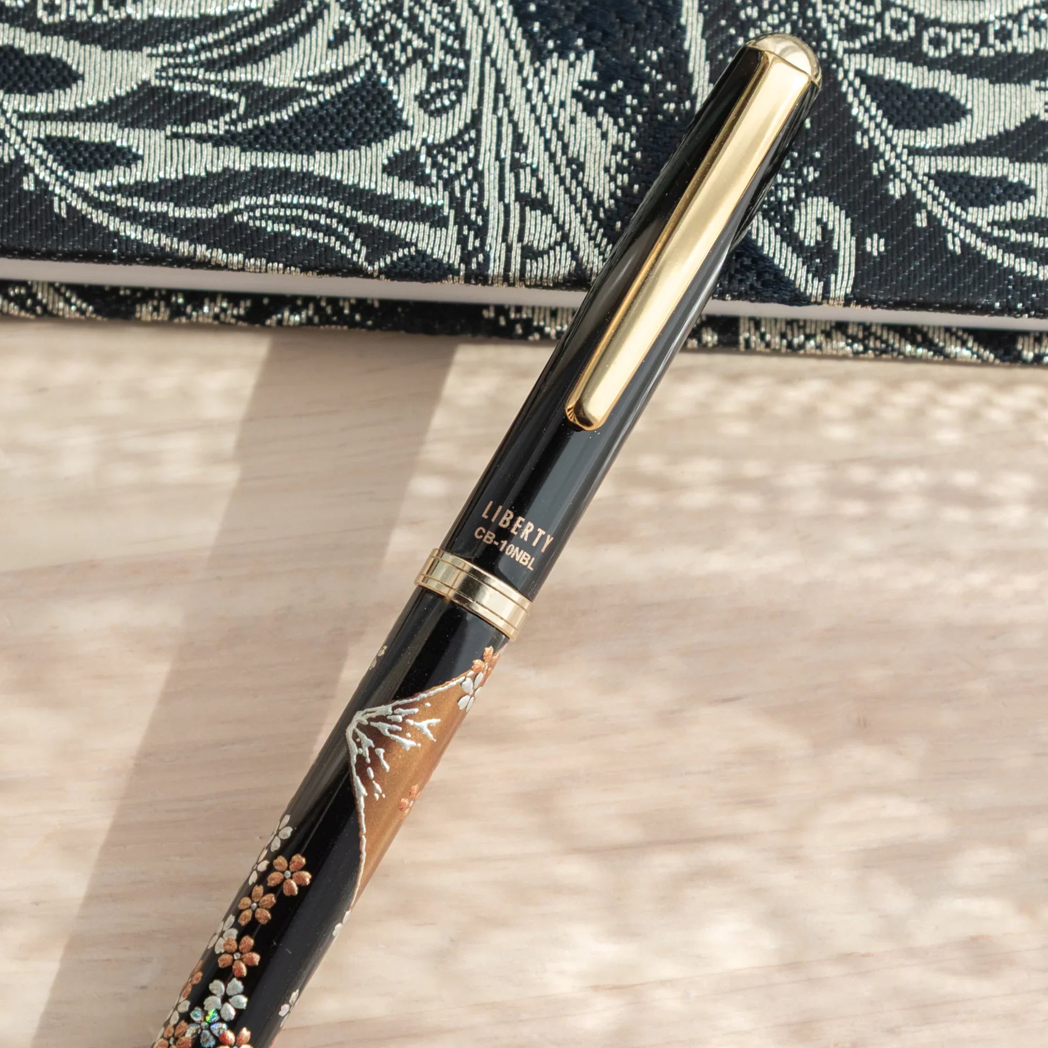Yamanaka made ballpoint pen displays fuji sakura landscape artwork with metallic gold accents, Japan lacquer