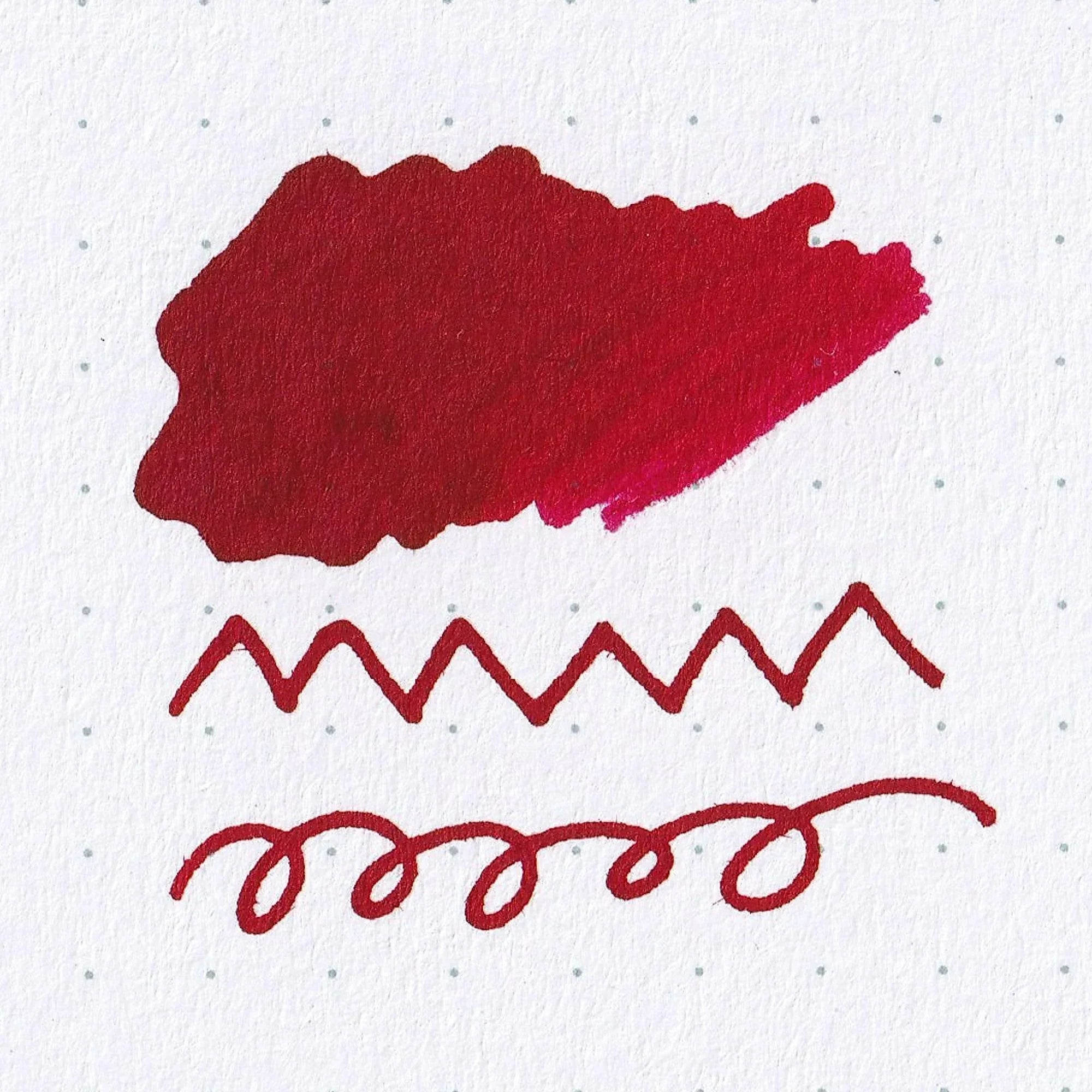 Deep crimson FUJIYAMA IRODORI AKANE fountain pen ink swatch showcasing rich burgundy tone on white paper with nib