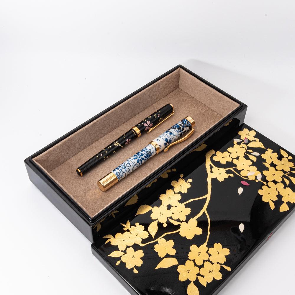 Pen box detail displaying sakura flower pattern with gold leaf highlights displayed clearly composition