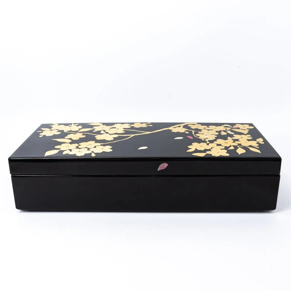Pen box in three-quarter view revealing gold-decorated lid structure and pattern displayed clearly composition