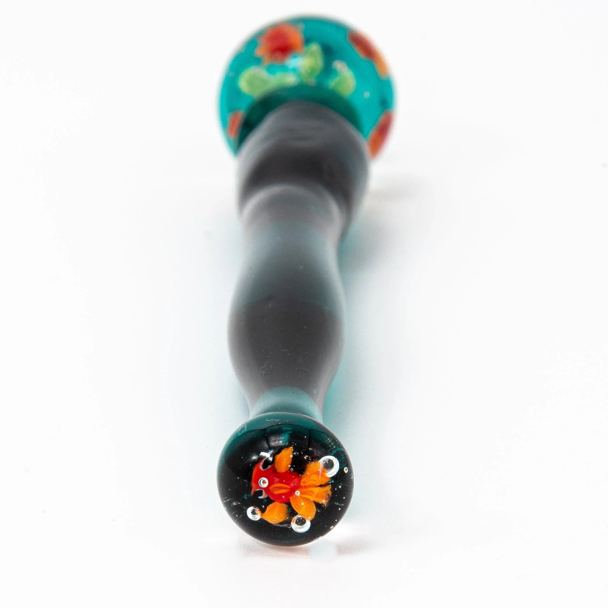 Vertical composition of glass pen with orange goldfish and green plants in both aquarium sections with handle detail and