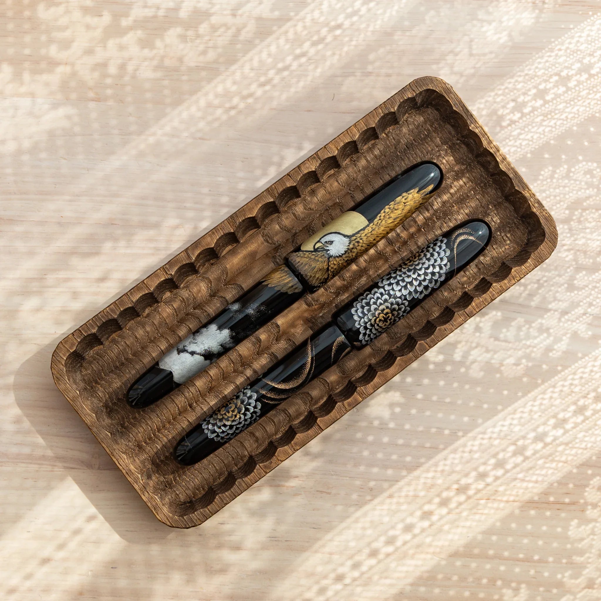 Slim wooden tray with hand-carved grooves shown from angled view clearly visible with precise carving detail
