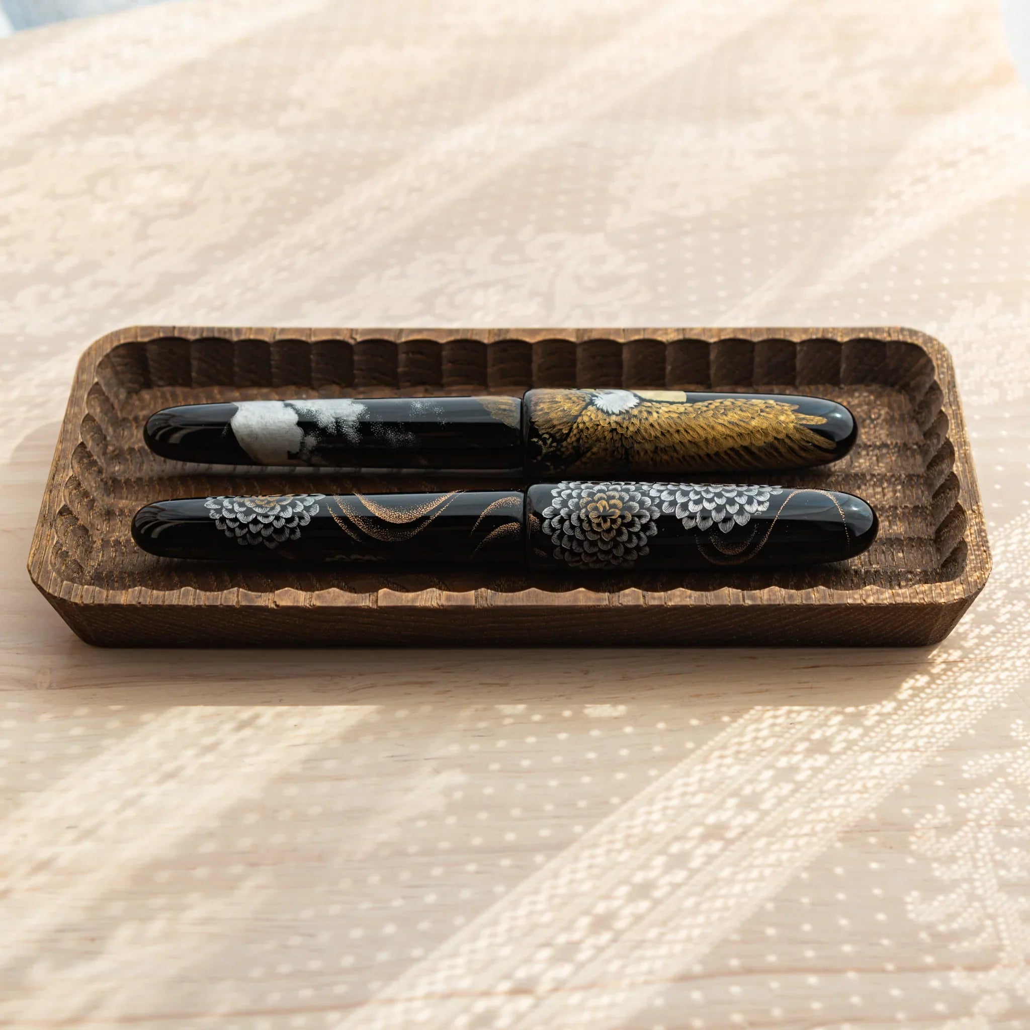 Light wood hand-carved tray showing ridge pattern detail and texture clearly visible with precise carving detail