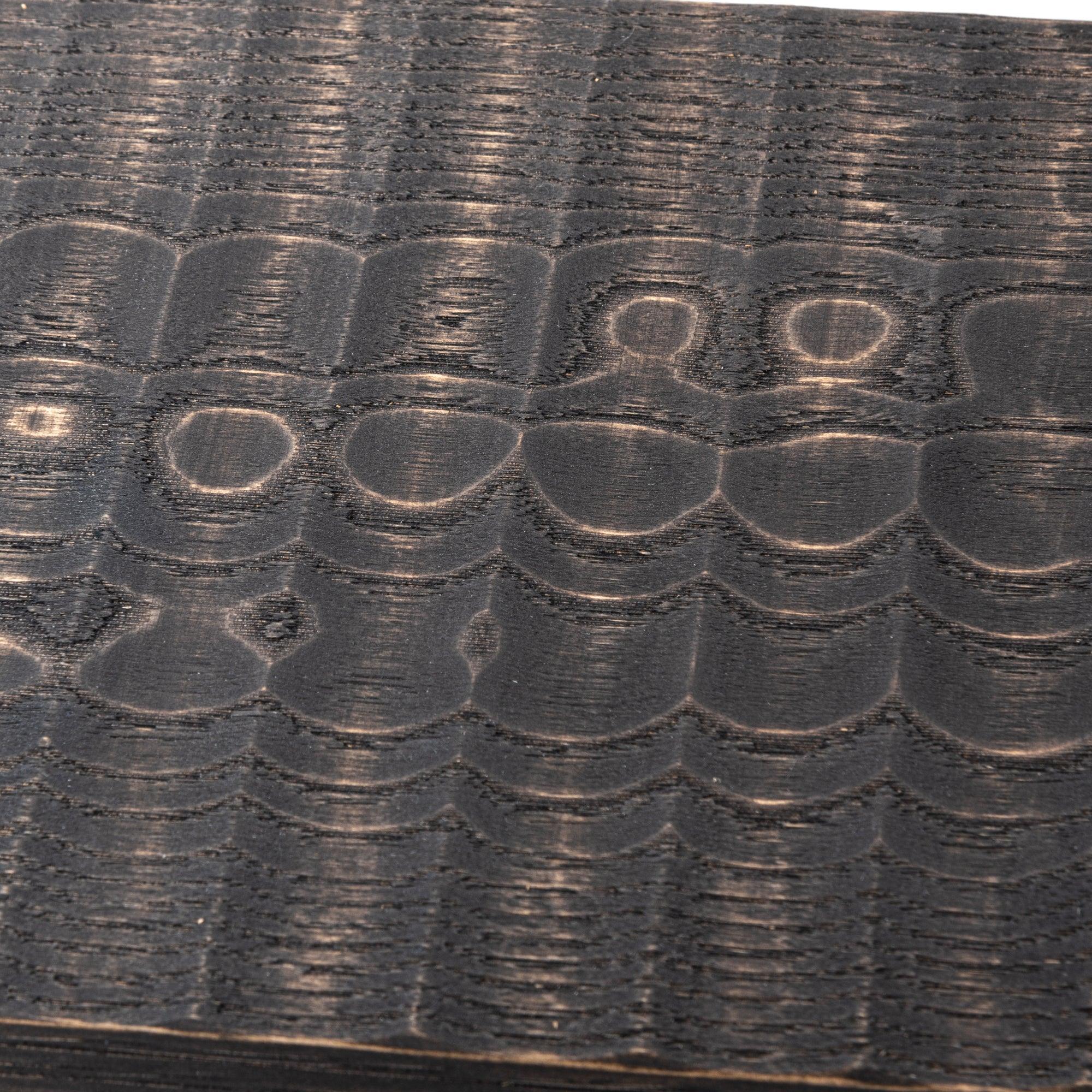 Chestnut wagatabon close-up showing carved channels, natural wood grain, and finished edges with clear visibility of design