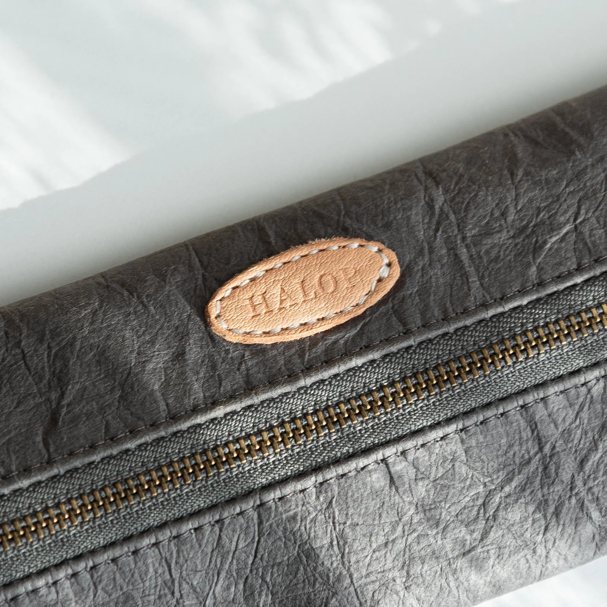 Gray Sugihara pen case detail showing washi paper texture and quality displayed clearly with hand-dyed finish
