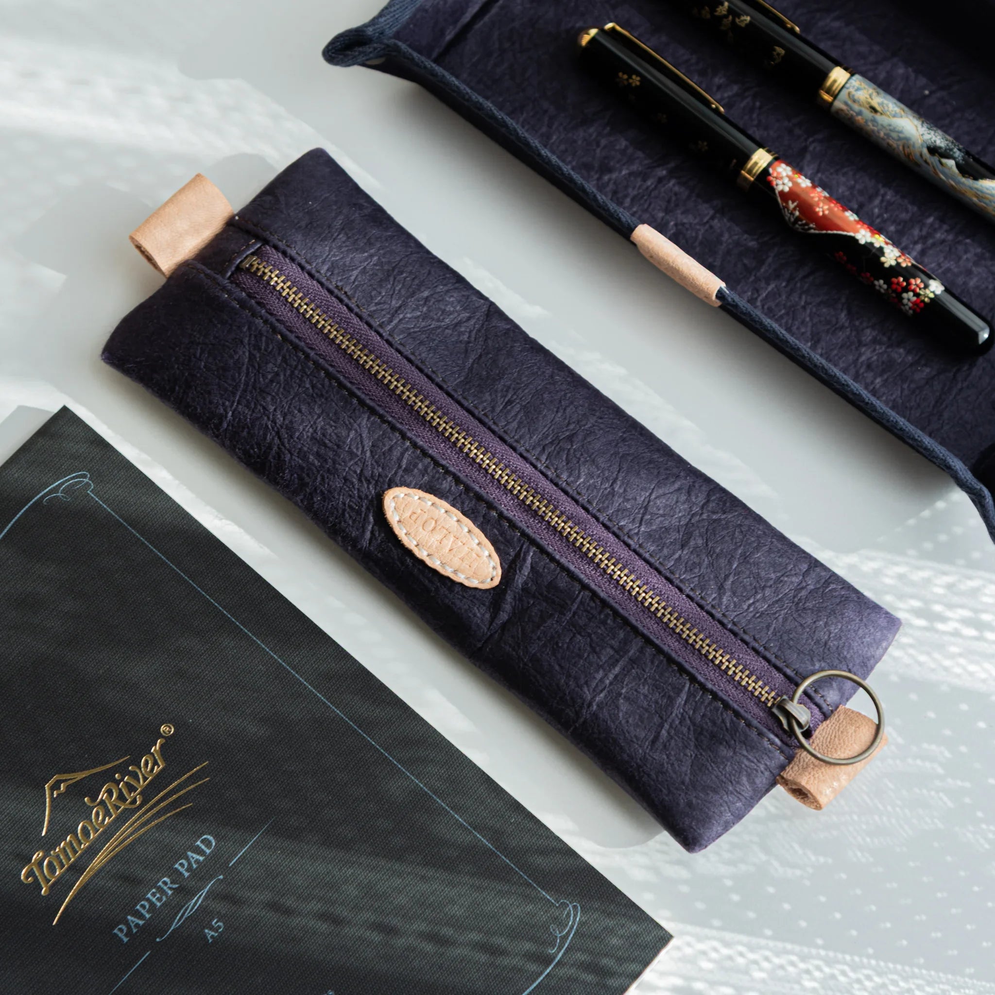 Handcrafted purple Sugihara case on light background showing form shown in composition with traditional construction