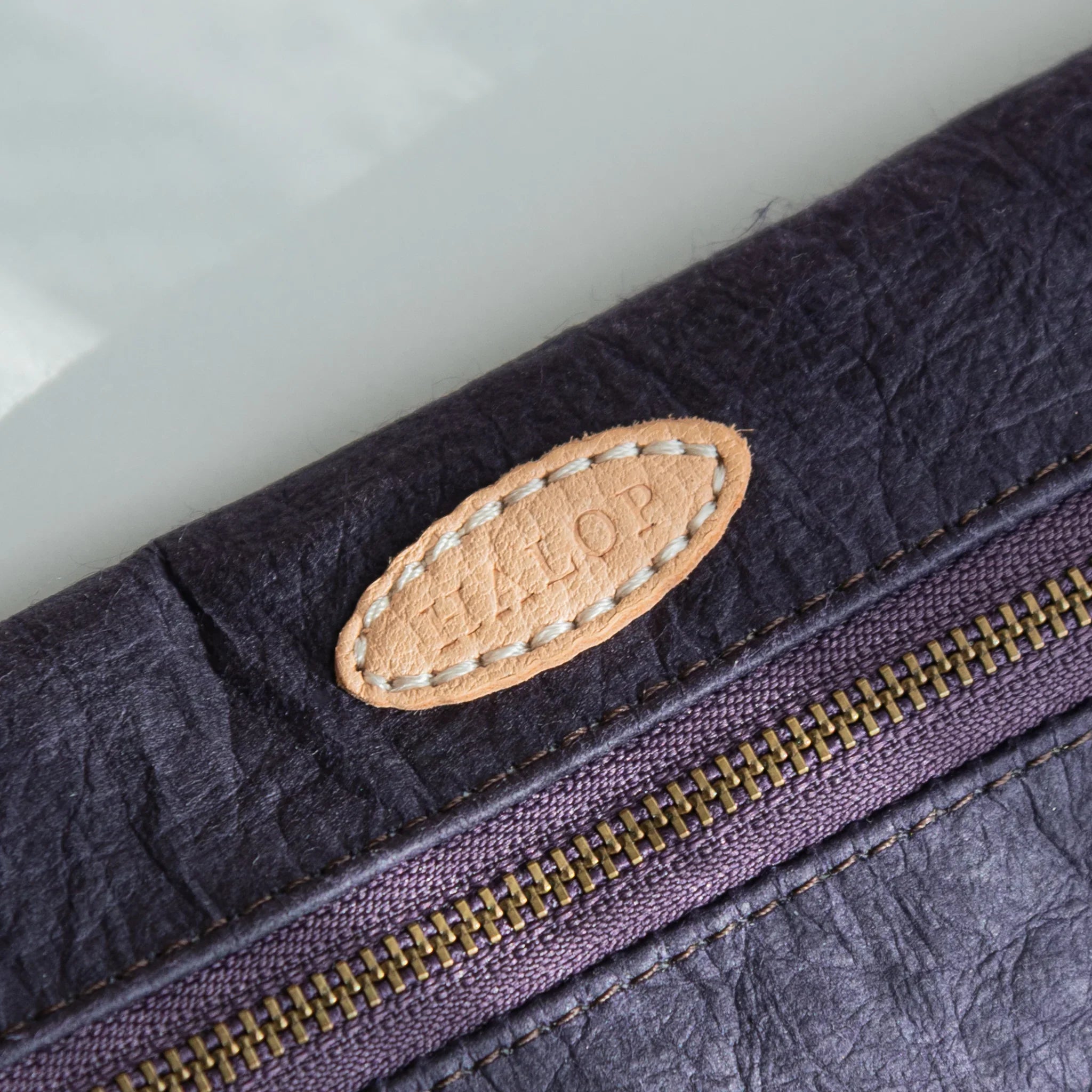 Washi paper pen case in purple flat lay composition on neutral surface displayed clearly with traditional construction