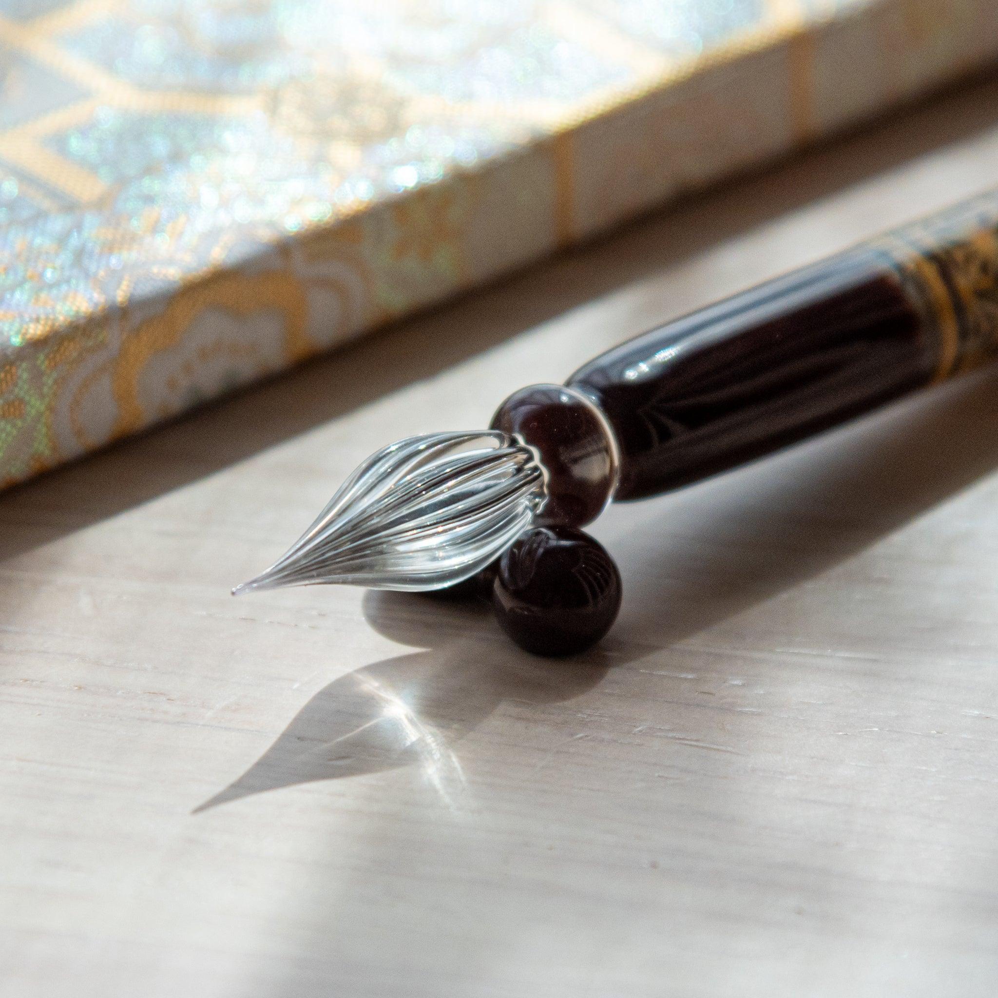Product styling of hemp leaves glass dip pen with geometric asanoha motif and glass pen rest holder included top