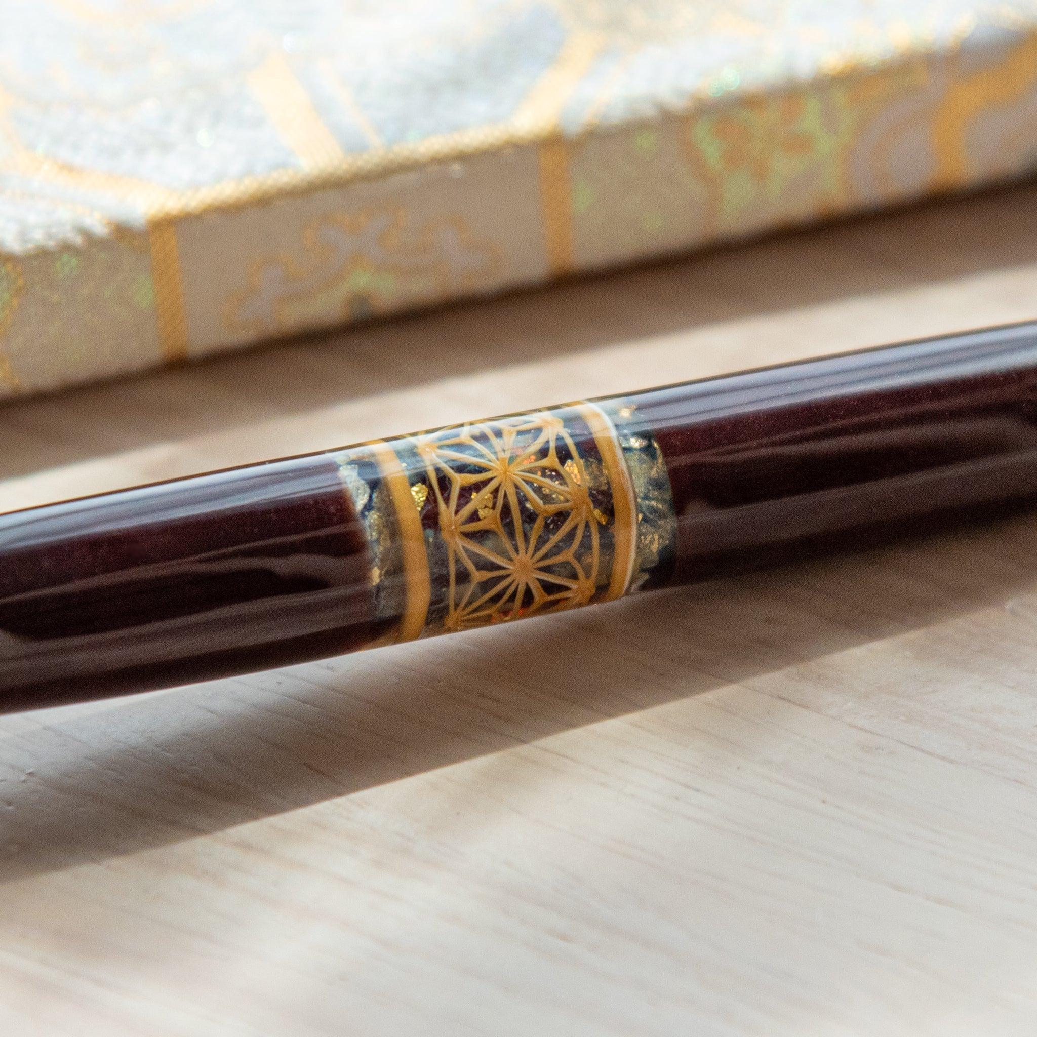 Detail shot of hemp leaves glass dip pen barrel revealing geometric asanoha hemp leaf pattern in clear glass top