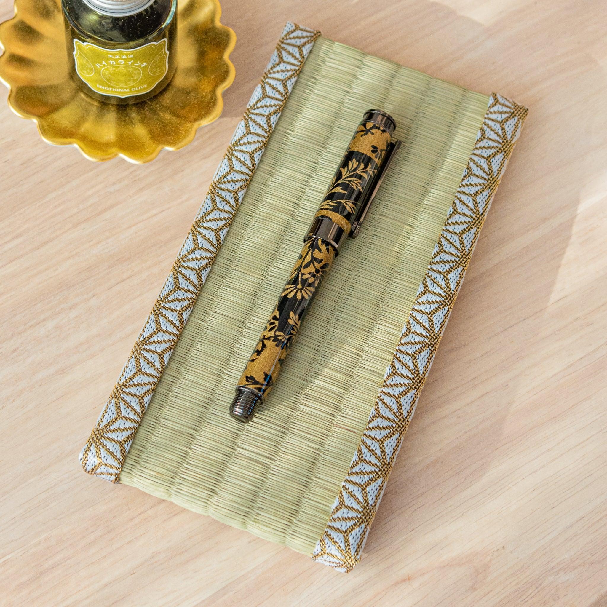 Natural tatami mat pen tray with pale green surface and hemp leaf asanoha pattern border with ink bottle styled