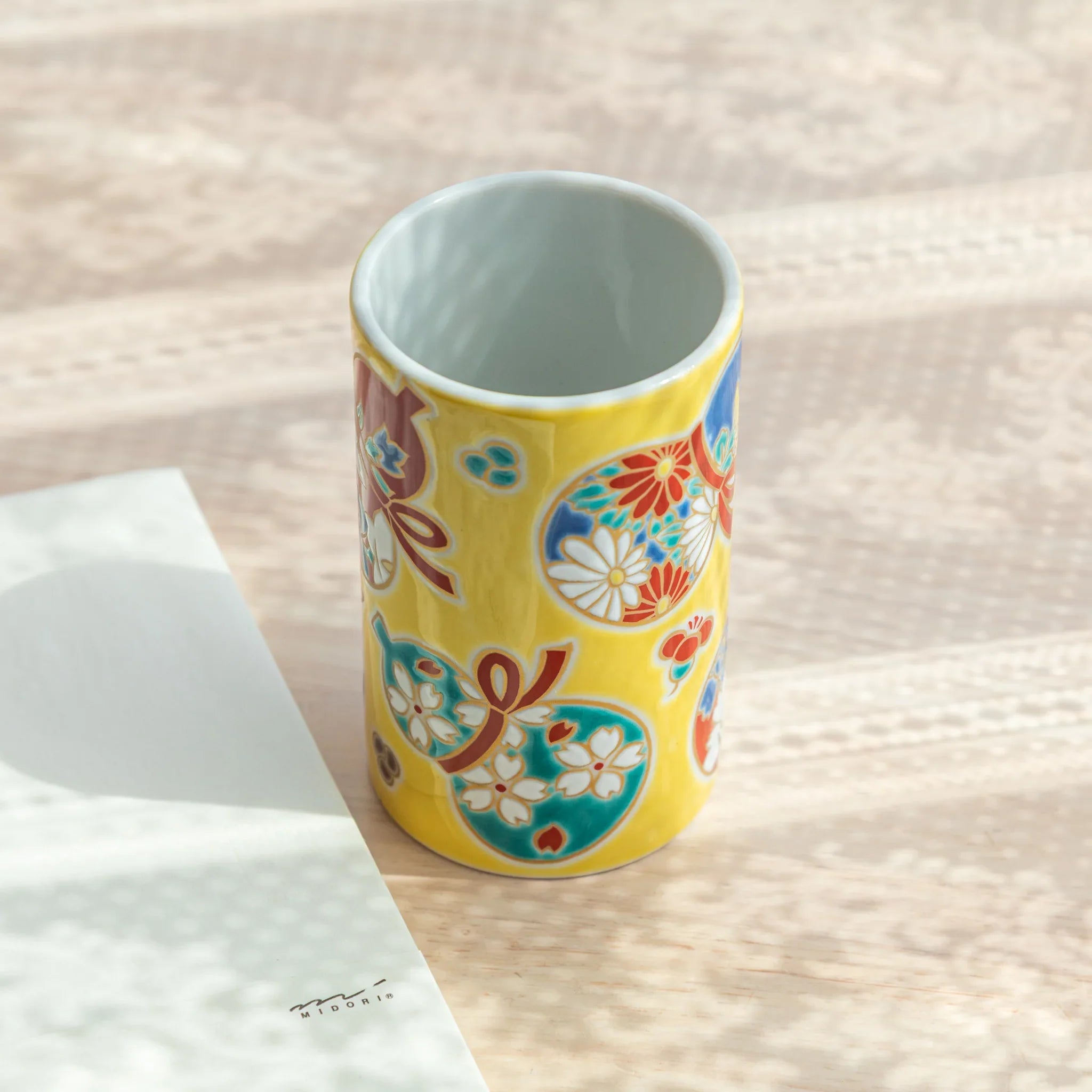 Decorative Kutani ceramic pen holder in gourd shape with vibrant hand-painted pattern for refined desk organization