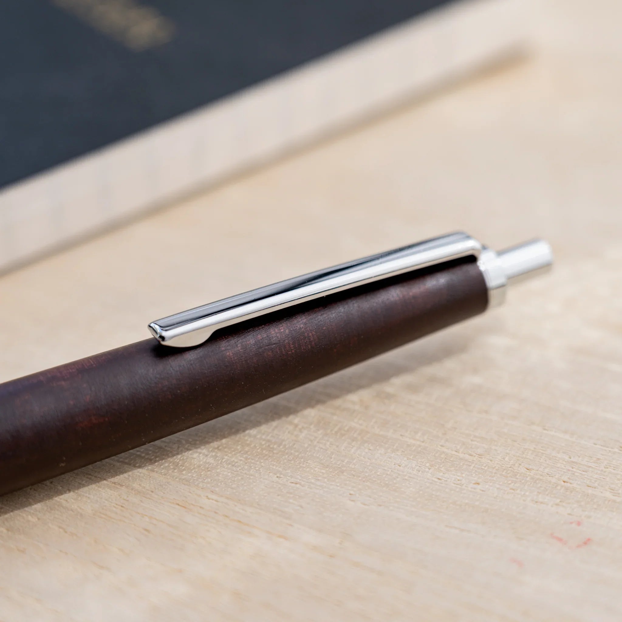 Horse chestnut wood urushi lacquered ballpoint pen in chocolate brown, Japanese wood, full-body view