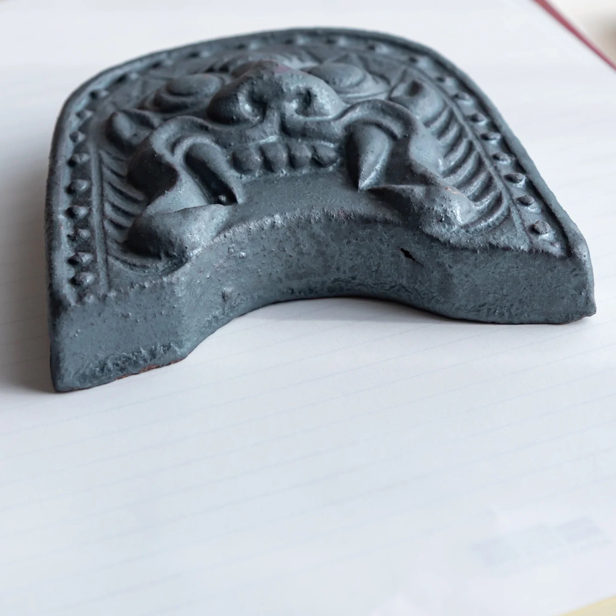 Japanese Kawara large roof guardian ceramic paperweight with steadfast expression shown in detailed composition