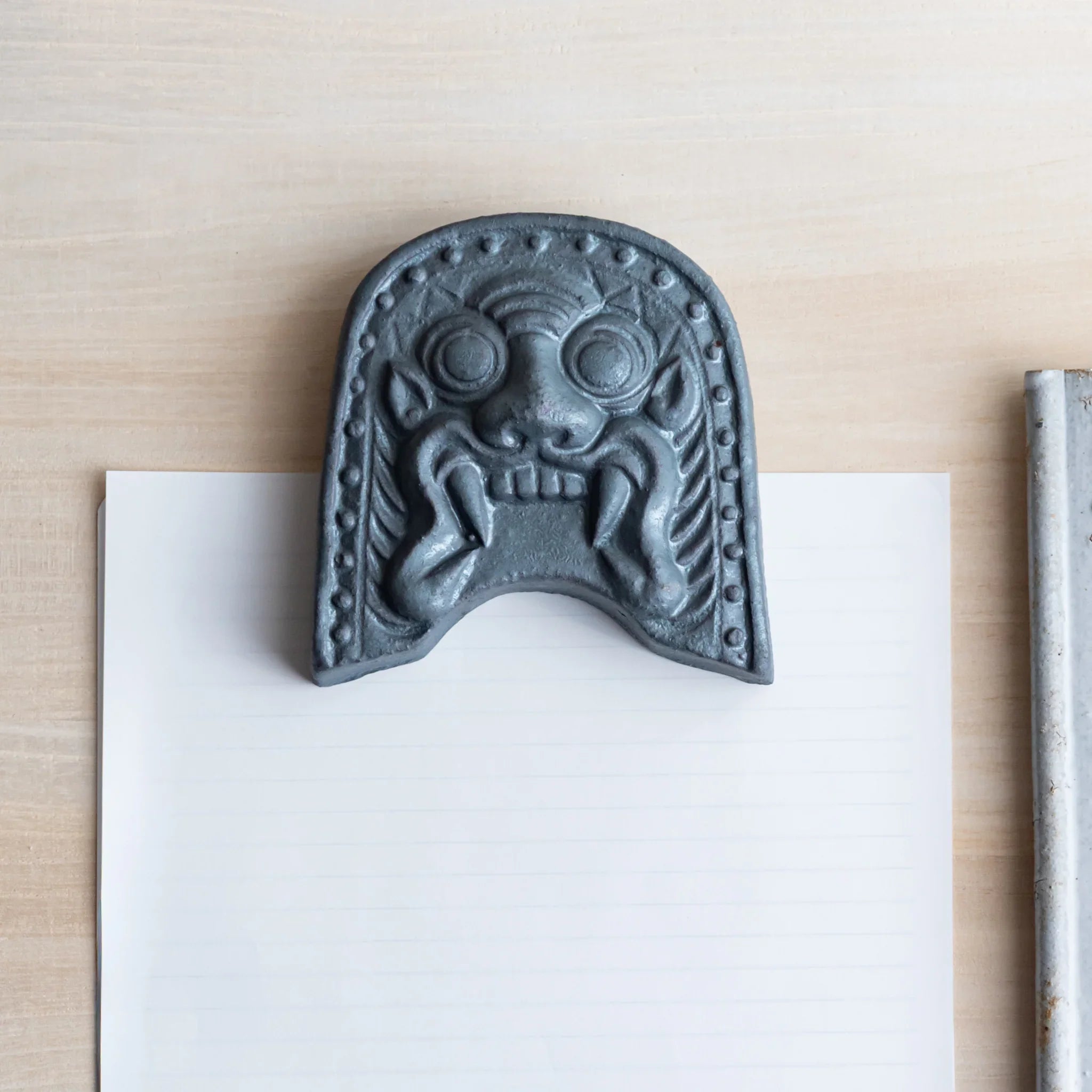 Japanese Kawara large roof guardian ceramic paperweight with steadfast expression shown shown in detail