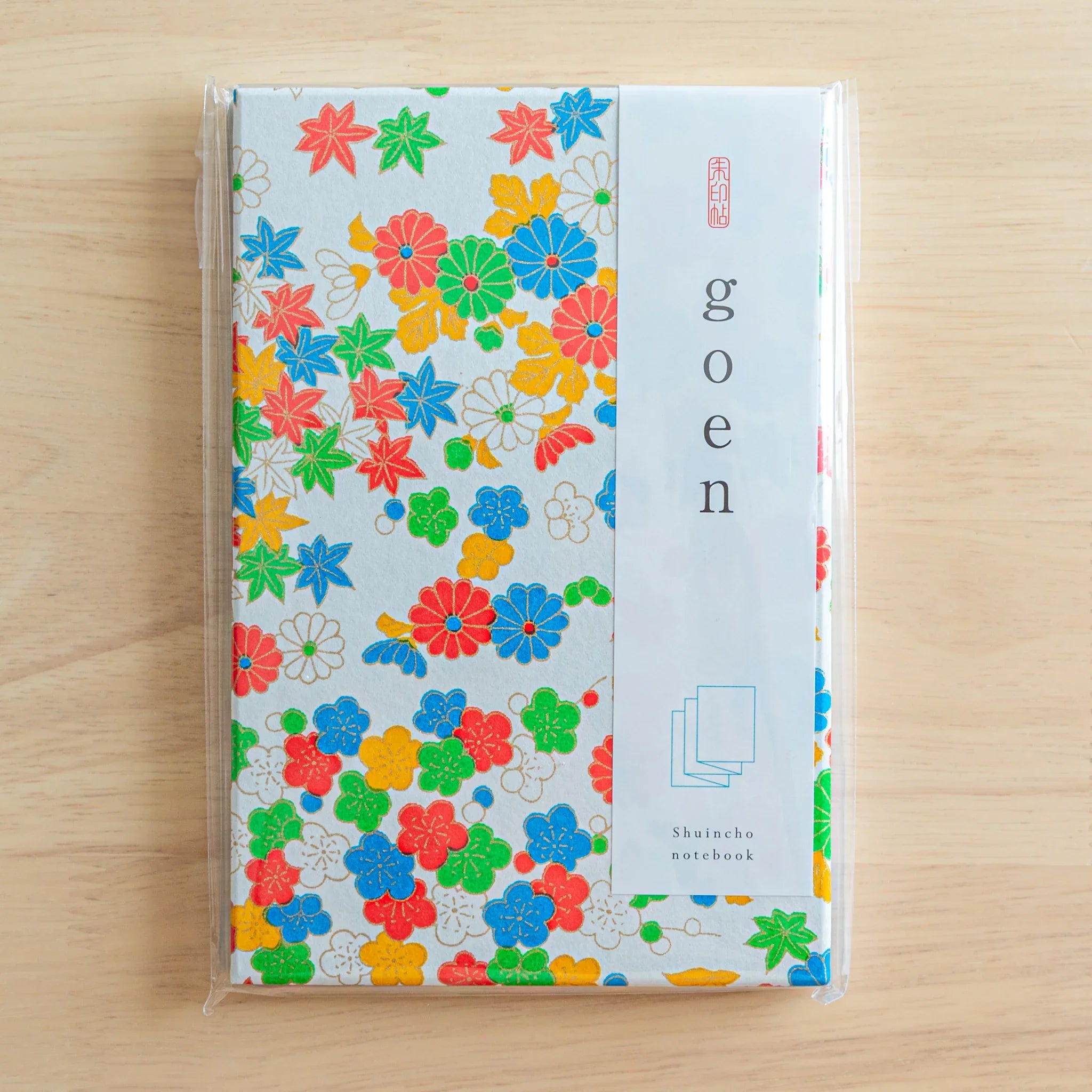 Joyful Flowers Washi Goshuincho Stamp Book tilted view showing spine and back cover with washi paper detail
