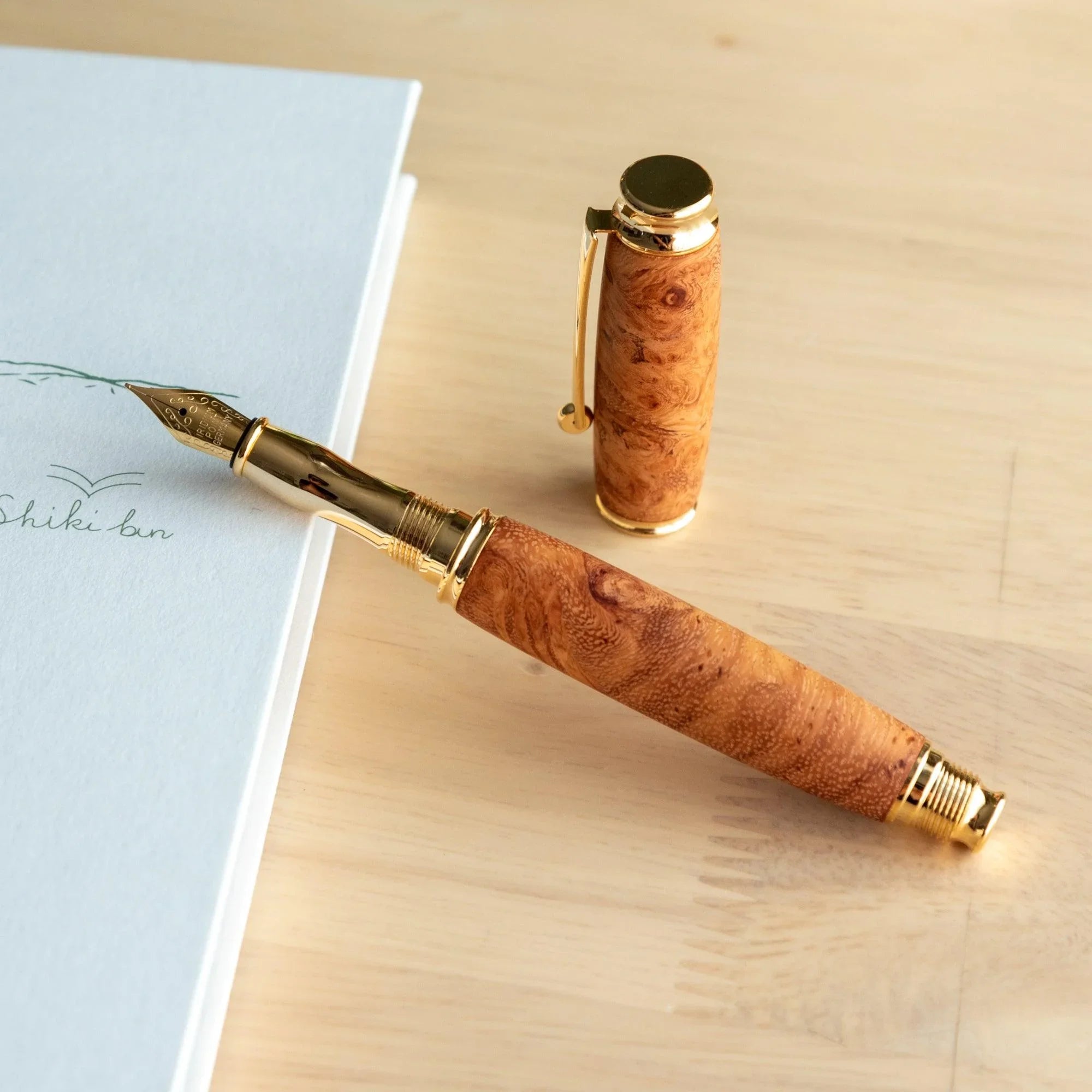 Japanese Karin Wood Screw Cap Fountain Pen angled view showing fine wood grain details and screw cap mechanism